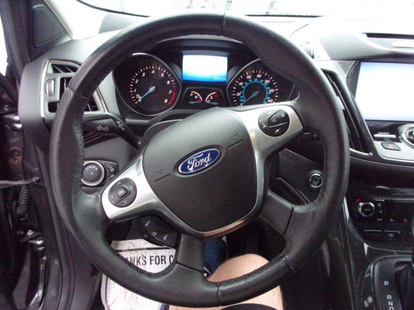 2015 GRAY FORD ESCAPE TITANIUM (1FMCU9J92FU) with an 2.0L engine, Automatic transmission, located at 501 E. Columbia St., Springfield, OH, 45503, (800) 262-7122, 39.925262, -83.801796 - ***Clean Carfax***4WD***Heated Leather Seating***Moonroof***Navigation***Titanium***Serviced and Detailed*** Jay North Auto has offered hand picked vehicles since 1965! Our customer's enjoy a NO pressure buying experience with a small town feel. All of our vehicles get fully inspected and detail - Photo#9