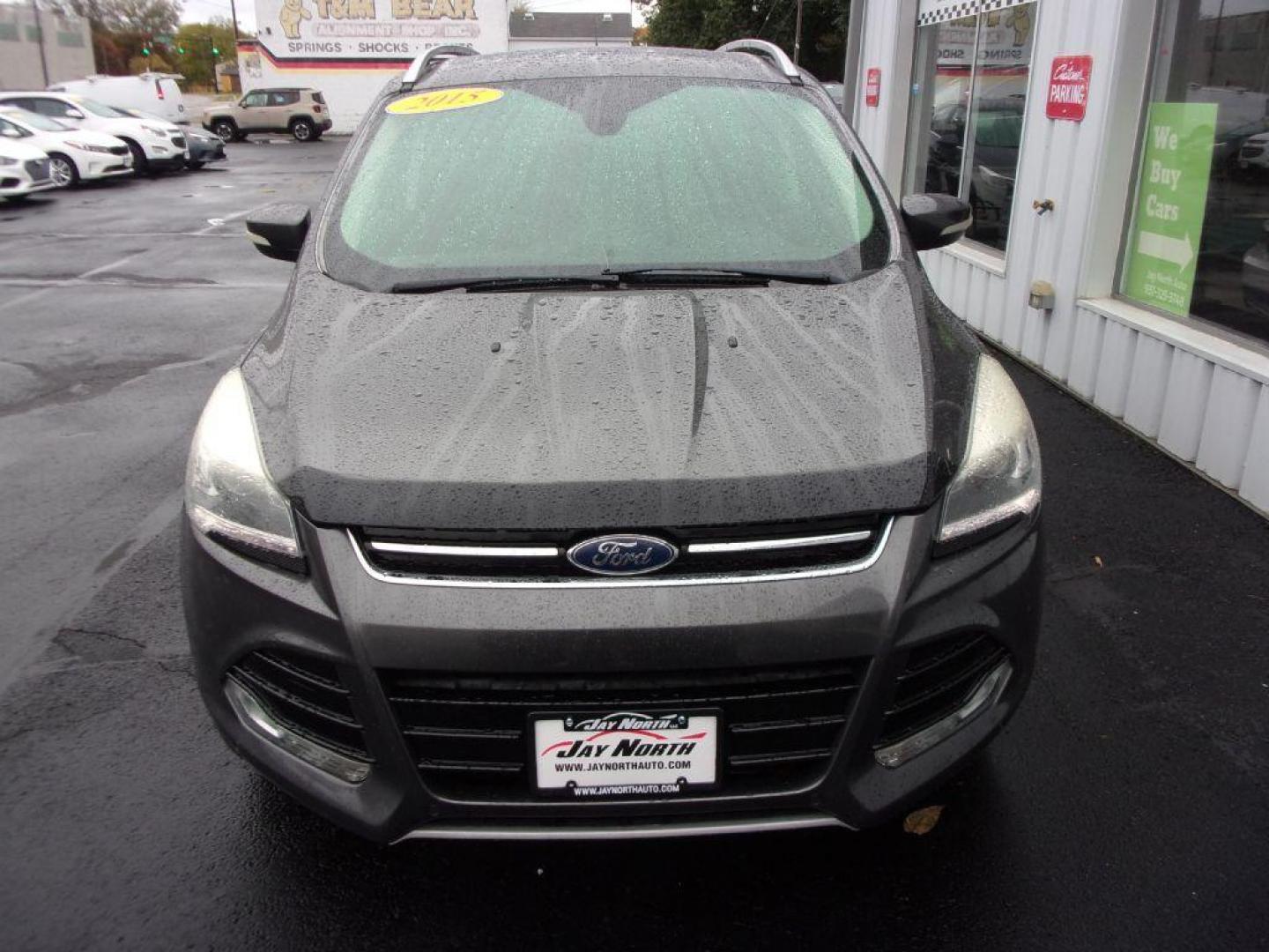 2015 GRAY FORD ESCAPE TITANIUM (1FMCU9J92FU) with an 2.0L engine, Automatic transmission, located at 501 E. Columbia St., Springfield, OH, 45503, (800) 262-7122, 39.925262, -83.801796 - ***Clean Carfax***4WD***Heated Leather Seating***Moonroof***Navigation***Titanium***Serviced and Detailed*** Jay North Auto has offered hand picked vehicles since 1965! Our customer's enjoy a NO pressure buying experience with a small town feel. All of our vehicles get fully inspected and detail - Photo#1