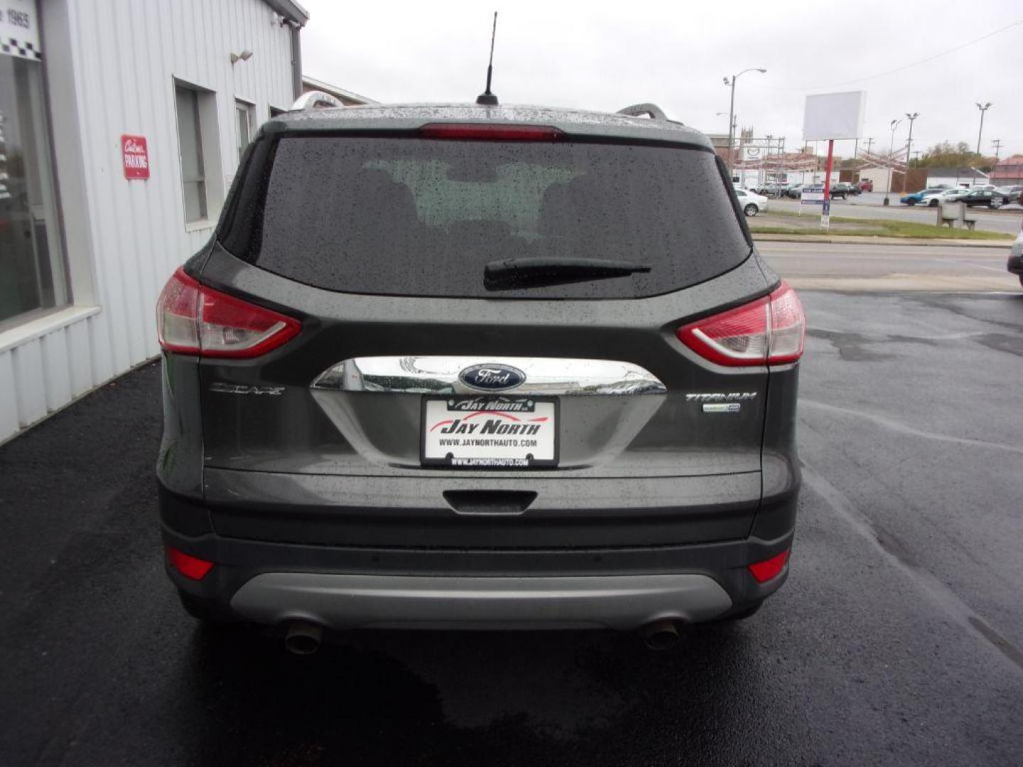 2015 GRAY FORD ESCAPE TITANIUM (1FMCU9J92FU) with an 2.0L engine, Automatic transmission, located at 501 E. Columbia St., Springfield, OH, 45503, (800) 262-7122, 39.925262, -83.801796 - ***Clean Carfax***4WD***Heated Leather Seating***Moonroof***Navigation***Titanium***Serviced and Detailed*** Jay North Auto has offered hand picked vehicles since 1965! Our customer's enjoy a NO pressure buying experience with a small town feel. All of our vehicles get fully inspected and detail - Photo#4