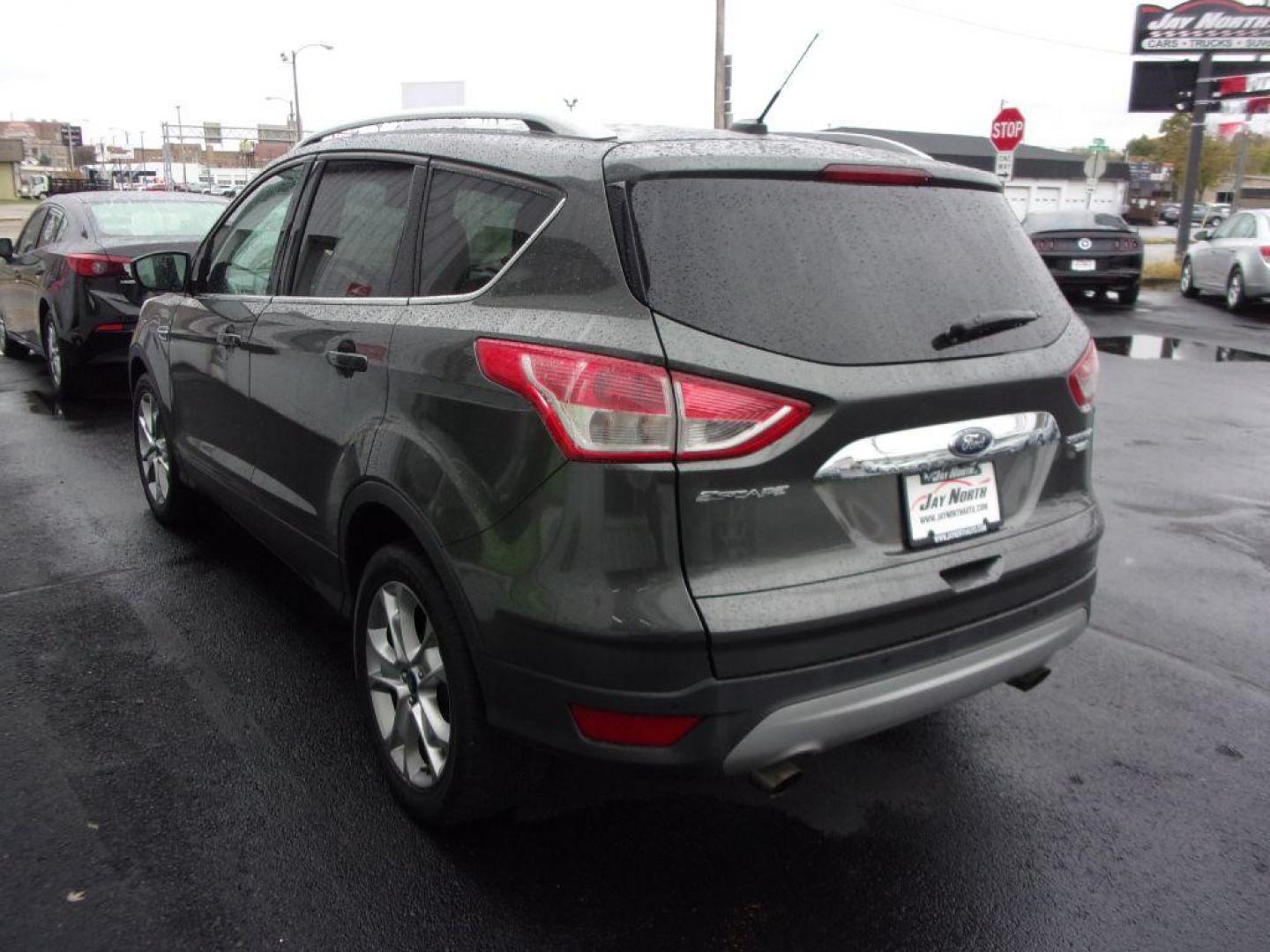 2015 GRAY FORD ESCAPE TITANIUM (1FMCU9J92FU) with an 2.0L engine, Automatic transmission, located at 501 E. Columbia St., Springfield, OH, 45503, (800) 262-7122, 39.925262, -83.801796 - ***Clean Carfax***4WD***Heated Leather Seating***Moonroof***Navigation***Titanium***Serviced and Detailed*** Jay North Auto has offered hand picked vehicles since 1965! Our customer's enjoy a NO pressure buying experience with a small town feel. All of our vehicles get fully inspected and detail - Photo#5