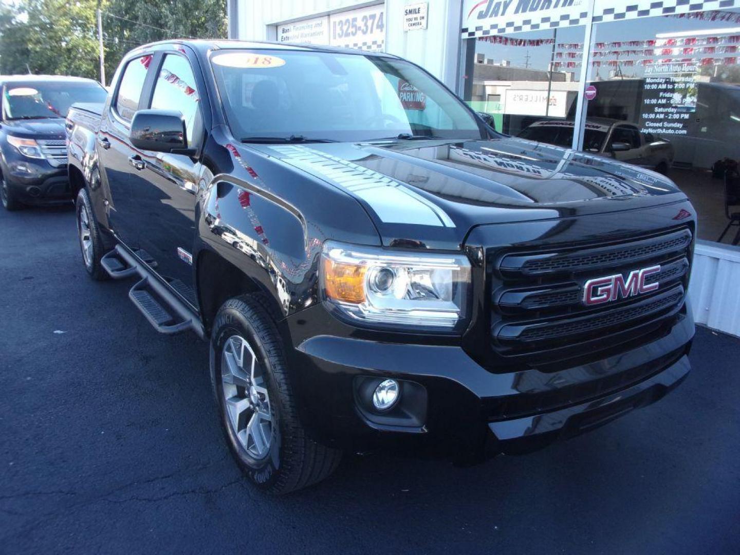 2018 BLACK GMC CANYON SLE (1GTG6CEN1J1) with an 3.6L engine, Automatic transmission, located at 501 E. Columbia St., Springfield, OH, 45503, (800) 262-7122, 39.925262, -83.801796 - *** New Goodyear Tires *** All Terrain Package *** 3.6L V6 *** Bose Audio *** Serviced and Detailed *** Bed Cover *** Bed Liner *** Tow Package *** Remote Start *** All Weather Mats *** NICE!!!! *** Jay North Auto has offered hand picked vehicles since 1965! Our customer's enjoy a NO pressure buy - Photo#1