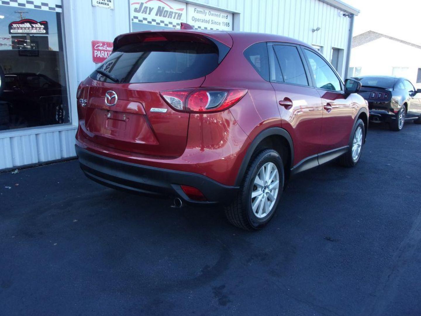 2013 RED MAZDA CX-5 TOURING (JM3KE4CE1D0) with an 2.0L engine, Automatic transmission, located at 501 E. Columbia St., Springfield, OH, 45503, (800) 262-7122, 39.925262, -83.801796 - ***1-Owner***AWD***Touring***Bose Sound System***Sunroof***Serviced and Detailed*** Jay North Auto has offered hand picked vehicles since 1965! Our customer's enjoy a NO pressure buying experience with a small town feel. All of our vehicles get fully inspected and detailed. We are a preferred de - Photo#3