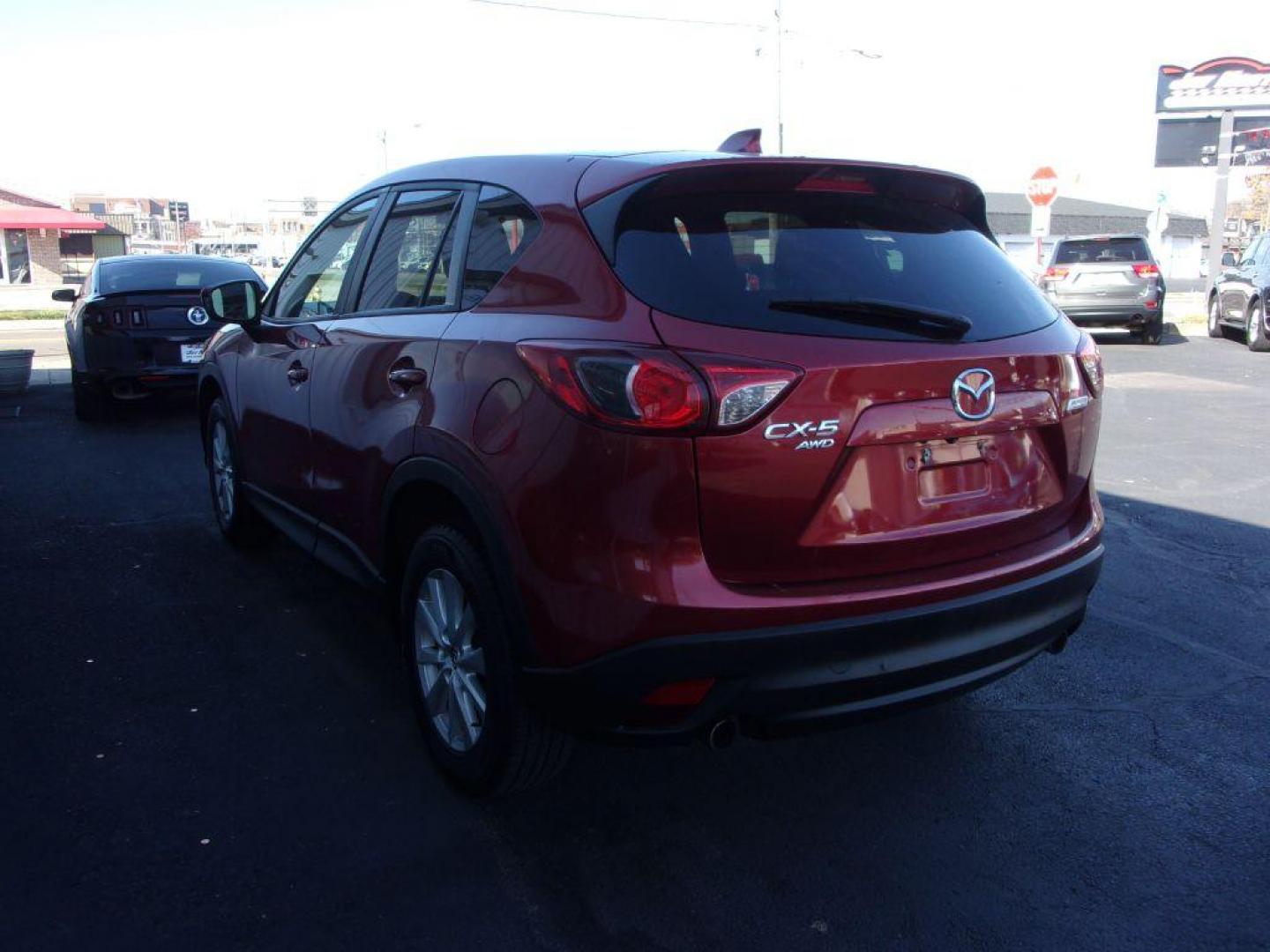 2013 RED MAZDA CX-5 TOURING (JM3KE4CE1D0) with an 2.0L engine, Automatic transmission, located at 501 E. Columbia St., Springfield, OH, 45503, (800) 262-7122, 39.925262, -83.801796 - ***1-Owner***AWD***Touring***Bose Sound System***Sunroof***Serviced and Detailed*** Jay North Auto has offered hand picked vehicles since 1965! Our customer's enjoy a NO pressure buying experience with a small town feel. All of our vehicles get fully inspected and detailed. We are a preferred de - Photo#5