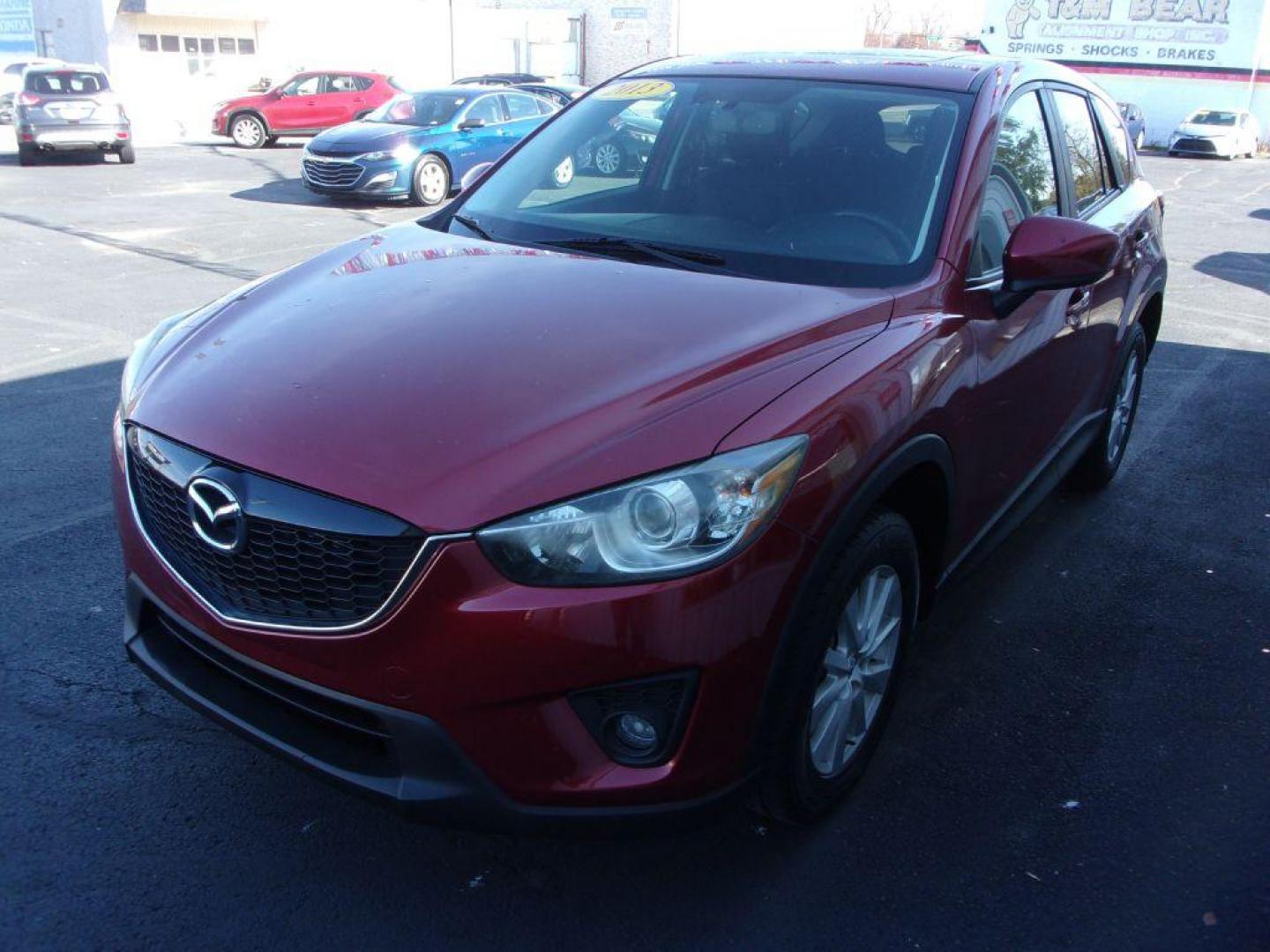 2013 RED MAZDA CX-5 TOURING (JM3KE4CE1D0) with an 2.0L engine, Automatic transmission, located at 501 E. Columbia St., Springfield, OH, 45503, (800) 262-7122, 39.925262, -83.801796 - ***1-Owner***AWD***Touring***Bose Sound System***Sunroof***Serviced and Detailed*** Jay North Auto has offered hand picked vehicles since 1965! Our customer's enjoy a NO pressure buying experience with a small town feel. All of our vehicles get fully inspected and detailed. We are a preferred de - Photo#6