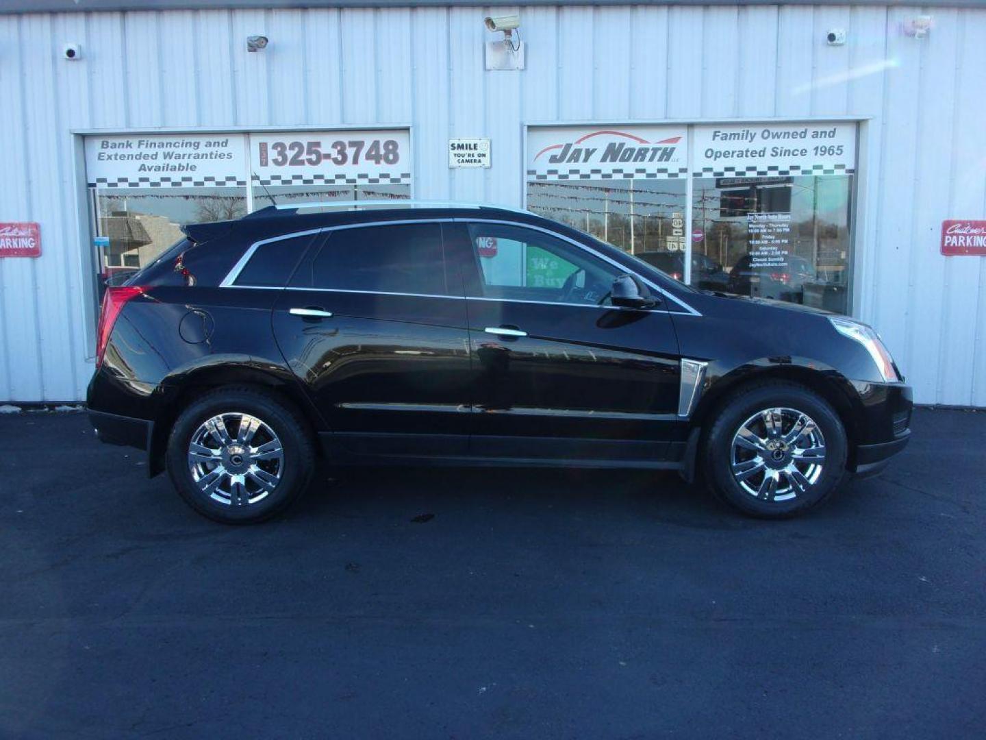 2014 BLACK CADILLAC SRX LUXURY COLLECTION (3GYFNBE32ES) with an 3.6L engine, Automatic transmission, located at 501 E. Columbia St., Springfield, OH, 45503, (800) 262-7122, 39.925262, -83.801796 - ***Clean Carfax***Panoramic Roof***Heated Leather Seating***Heated Steering Wheel***Blind Spot***New Tires***Navigation***Serviced and Detailed*** - Photo#0