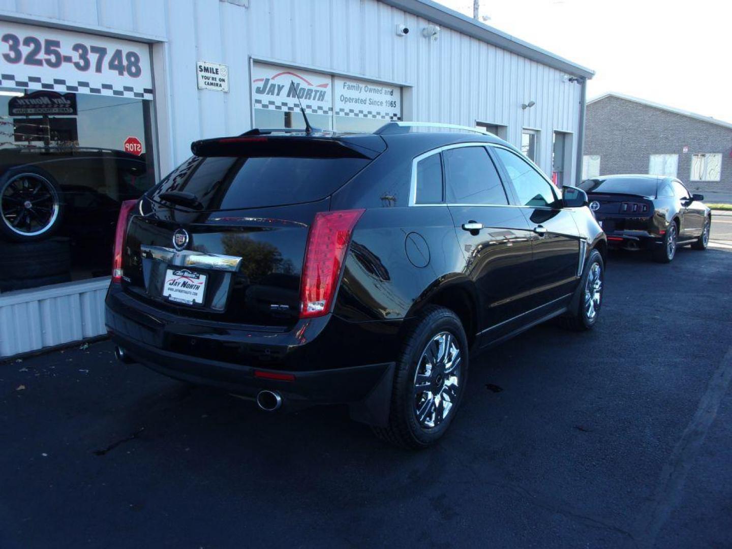 2014 BLACK CADILLAC SRX LUXURY COLLECTION (3GYFNBE32ES) with an 3.6L engine, Automatic transmission, located at 501 E. Columbia St., Springfield, OH, 45503, (800) 262-7122, 39.925262, -83.801796 - ***Clean Carfax***Panoramic Roof***Heated Leather Seating***Heated Steering Wheel***Blind Spot***New Tires***Navigation***Serviced and Detailed*** - Photo#3