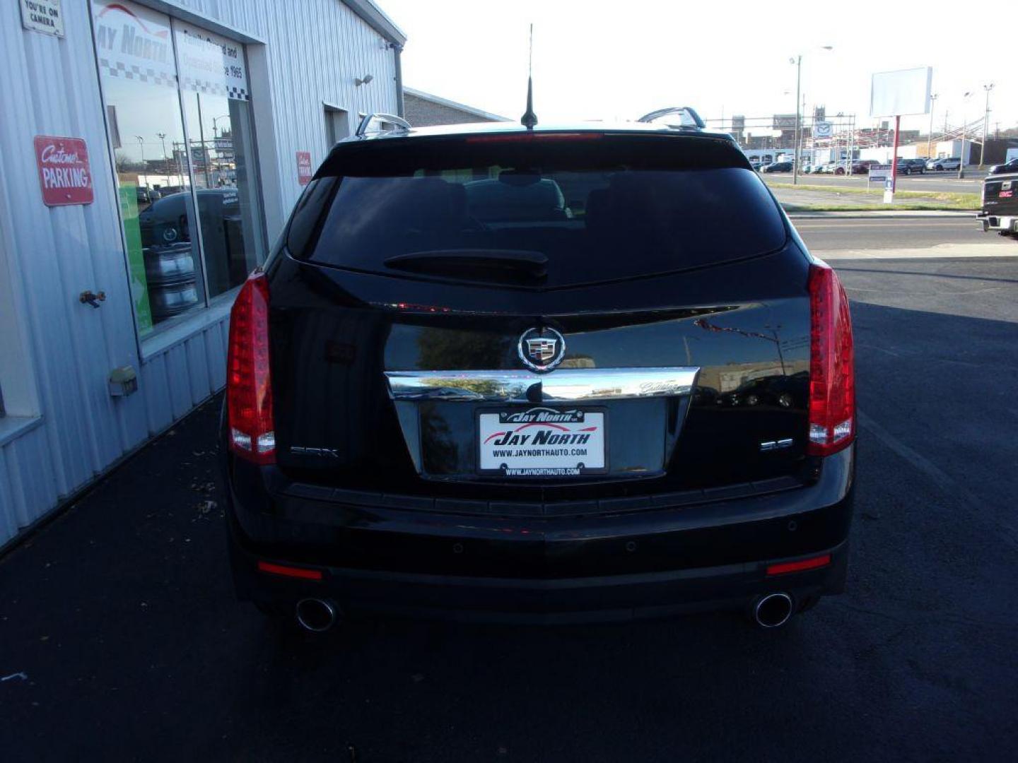 2014 BLACK CADILLAC SRX LUXURY COLLECTION (3GYFNBE32ES) with an 3.6L engine, Automatic transmission, located at 501 E. Columbia St., Springfield, OH, 45503, (800) 262-7122, 39.925262, -83.801796 - ***Clean Carfax***Panoramic Roof***Heated Leather Seating***Heated Steering Wheel***Blind Spot***New Tires***Navigation***Serviced and Detailed*** - Photo#4