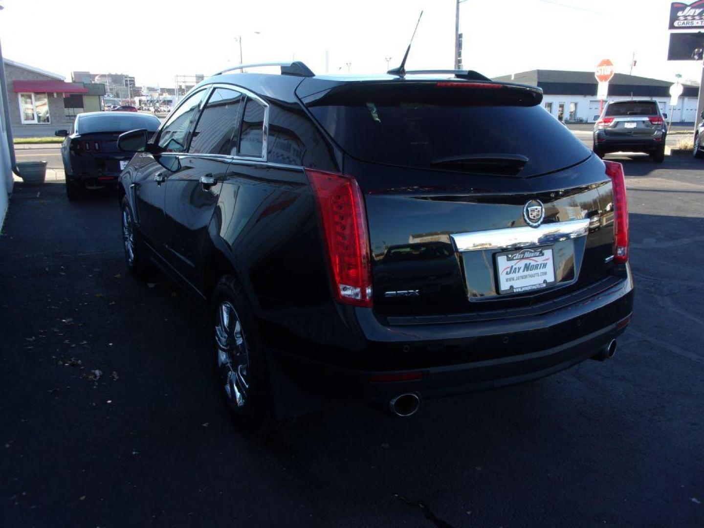 2014 BLACK CADILLAC SRX LUXURY COLLECTION (3GYFNBE32ES) with an 3.6L engine, Automatic transmission, located at 501 E. Columbia St., Springfield, OH, 45503, (800) 262-7122, 39.925262, -83.801796 - ***Clean Carfax***Panoramic Roof***Heated Leather Seating***Heated Steering Wheel***Blind Spot***New Tires***Navigation***Serviced and Detailed*** - Photo#5