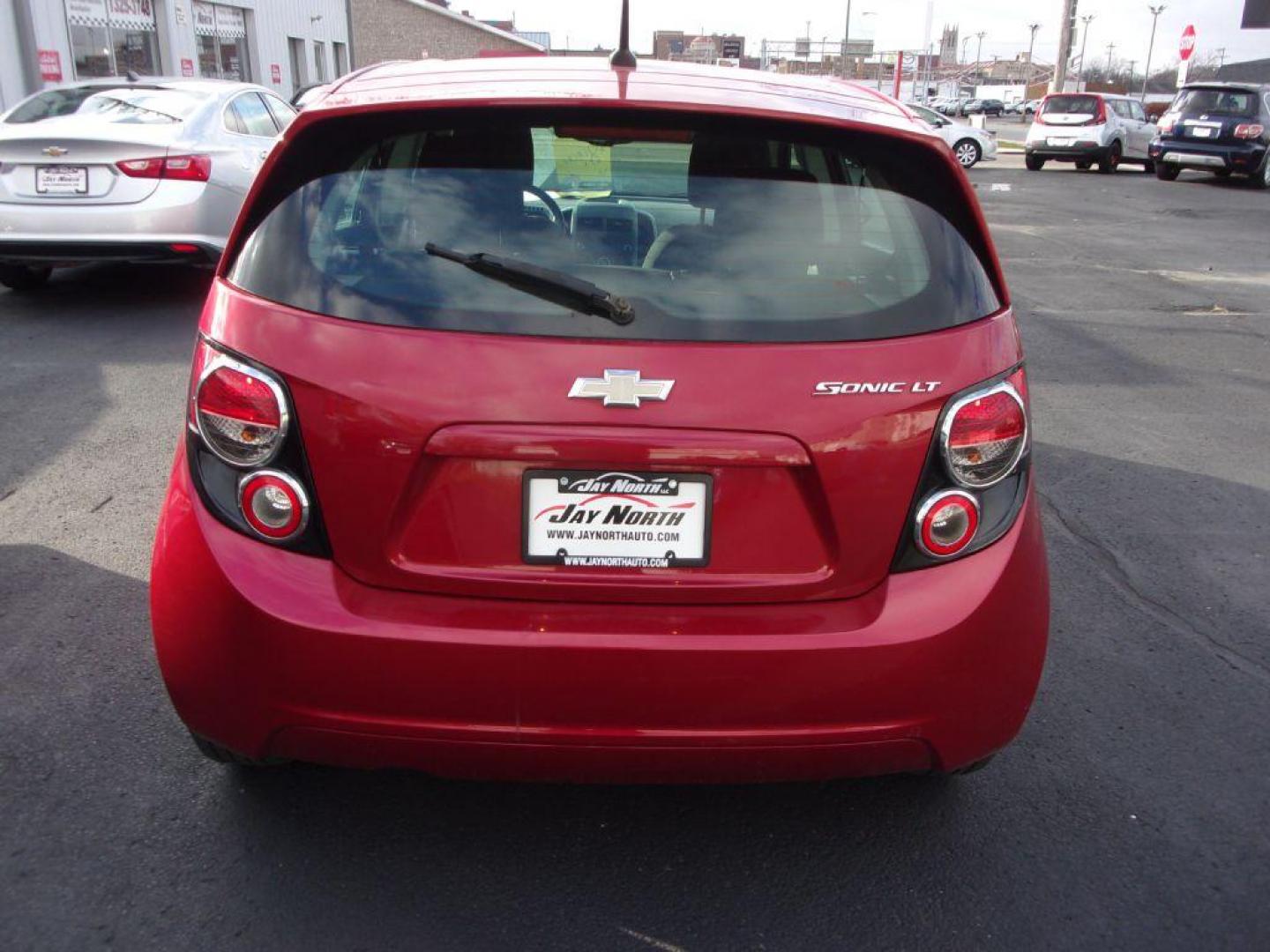 2014 RED CHEVROLET SONIC LT (1G1JC6SH6E4) with an 1.8L engine, Automatic transmission, located at 501 E. Columbia St., Springfield, OH, 45503, (800) 262-7122, 39.925262, -83.801796 - Photo#5