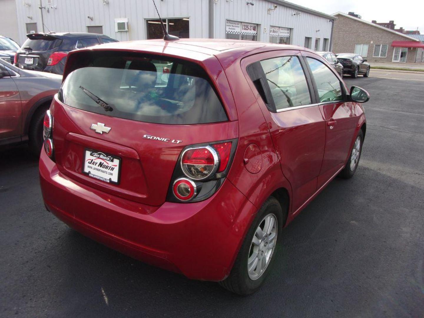 2014 RED CHEVROLET SONIC LT (1G1JC6SH6E4) with an 1.8L engine, Automatic transmission, located at 501 E. Columbia St., Springfield, OH, 45503, (800) 262-7122, 39.925262, -83.801796 - Photo#6