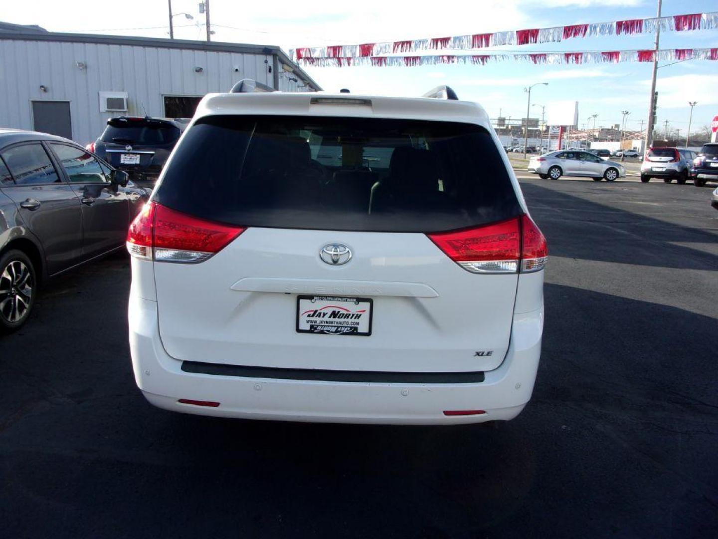 2012 WHITE TOYOTA SIENNA XLE (5TDYK3DC0CS) with an 3.5L engine, Automatic transmission, located at 501 E. Columbia St., Springfield, OH, 45503, (800) 262-7122, 39.925262, -83.801796 - *** XLE *** Serviced and Detailed *** V6 *** Power Doors *** Power Rear Lift Gate *** Clean CarFax *** Moonroof *** Jay North Auto has offered hand picked vehicles since 1965! Our customer's enjoy a NO pressure buying experience with a small town feel. All of our vehicles get fully inspected an - Photo#5