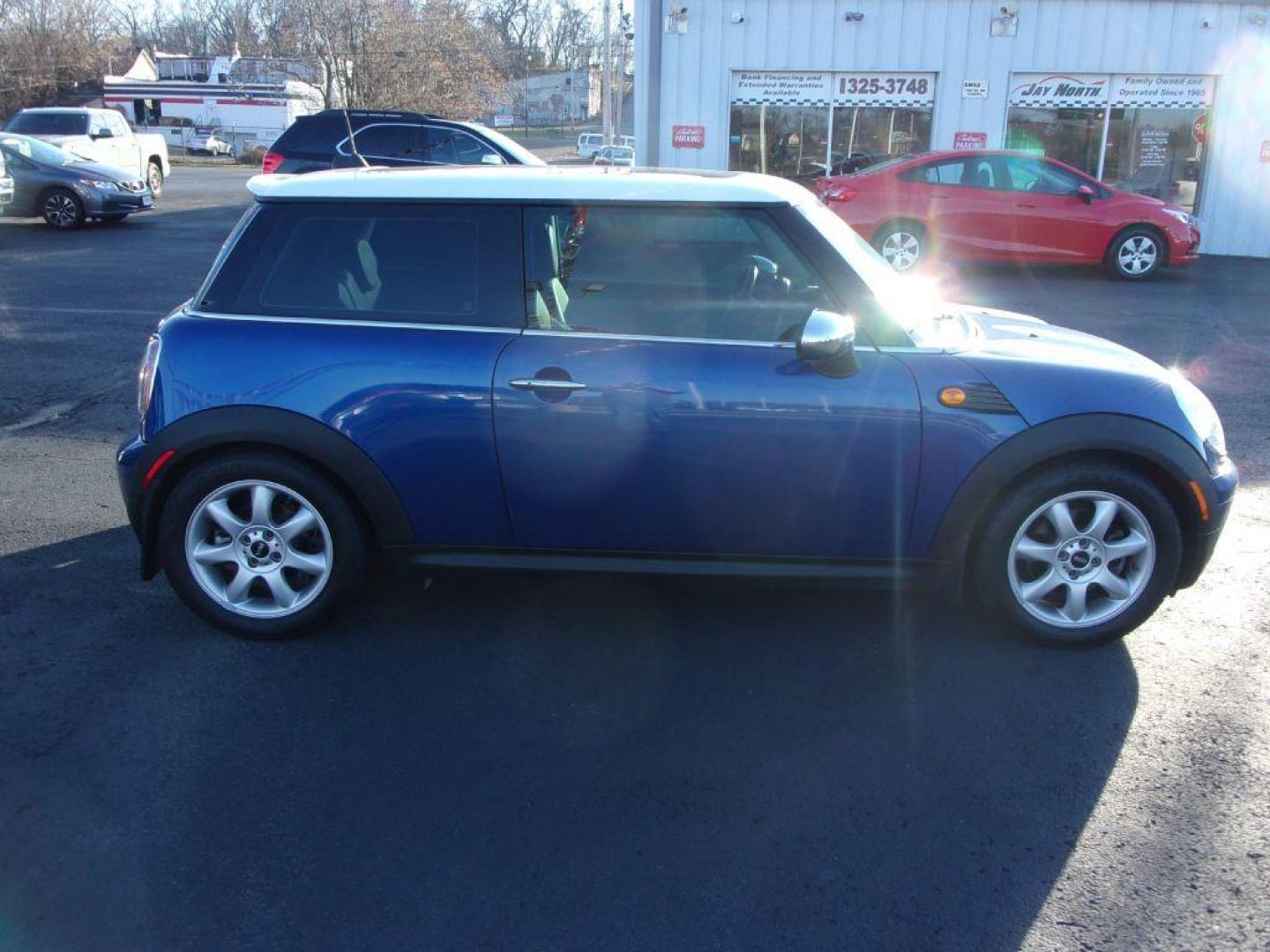 2008 BLUE MINI COOPER (WMWMF33568T) with an 1.6L engine, 6-Speed Manual transmission, located at 501 E. Columbia St., Springfield, OH, 45503, (800) 262-7122, 39.925262, -83.801796 - ***Clean Carfax***Mini Cooper***6-speed Manual***Leather Seating***Sunroof***Serviced and Detailed*** Jay North Auto has offered hand picked vehicles since 1965! Our customer's enjoy a NO pressure buying experience with a small town feel. All of our vehicles get fully inspected and detailed. We - Photo#1