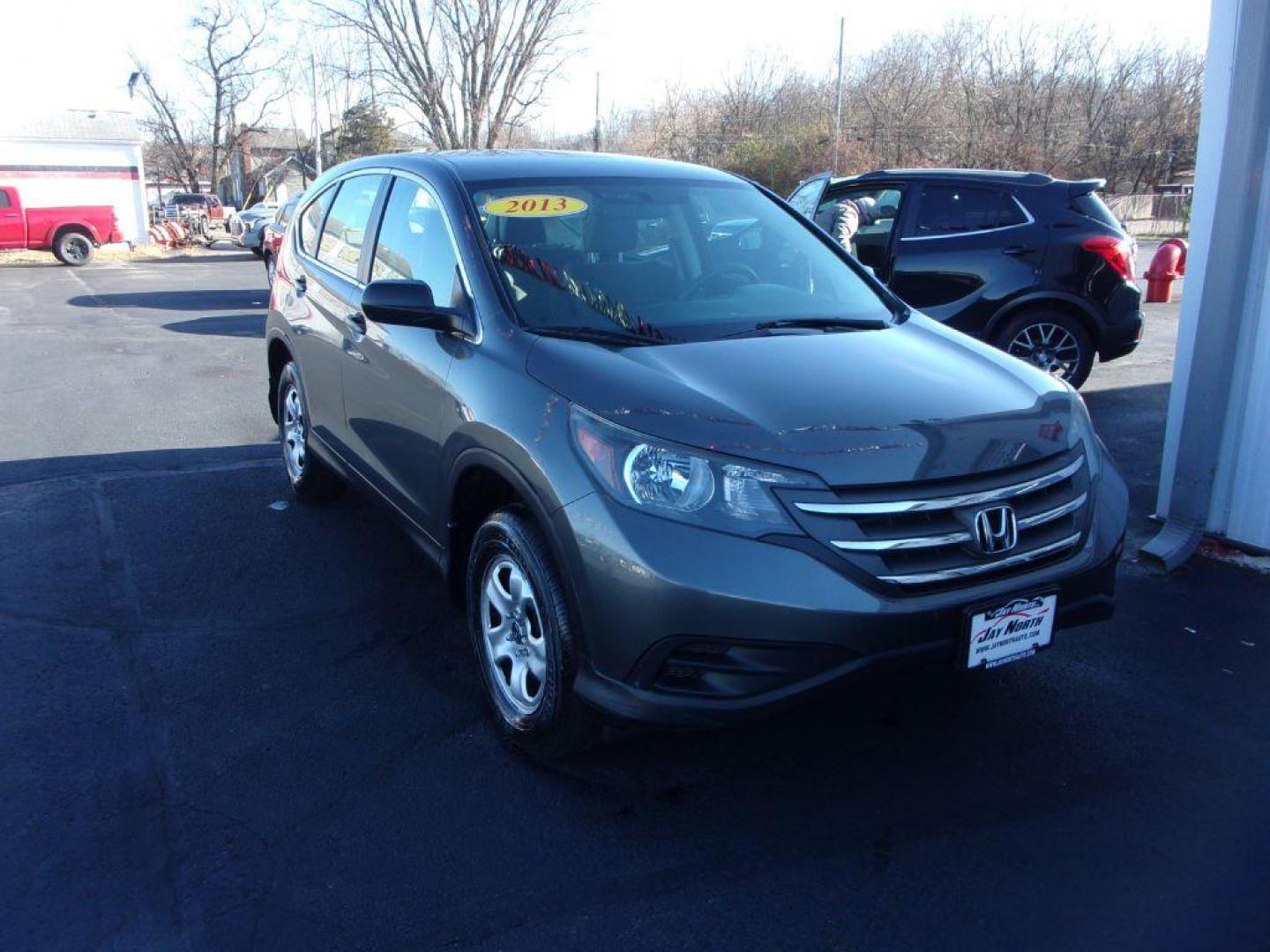 2013 GRAY HONDA CR-V LX (5J6RM4H34DL) with an 2.4L engine, Automatic transmission, located at 501 E. Columbia St., Springfield, OH, 45503, (800) 262-7122, 39.925262, -83.801796 - *** 1 Owner w/ Clean CarFax *** Regular Oil Changes *** Serviced and Detailed *** New Tires *** All Wheel Drive *** Jay North Auto has offered hand picked vehicles since 1965! Our customer's enjoy a NO pressure buying experience with a small town feel. All of our vehicles get fully inspected and - Photo#2