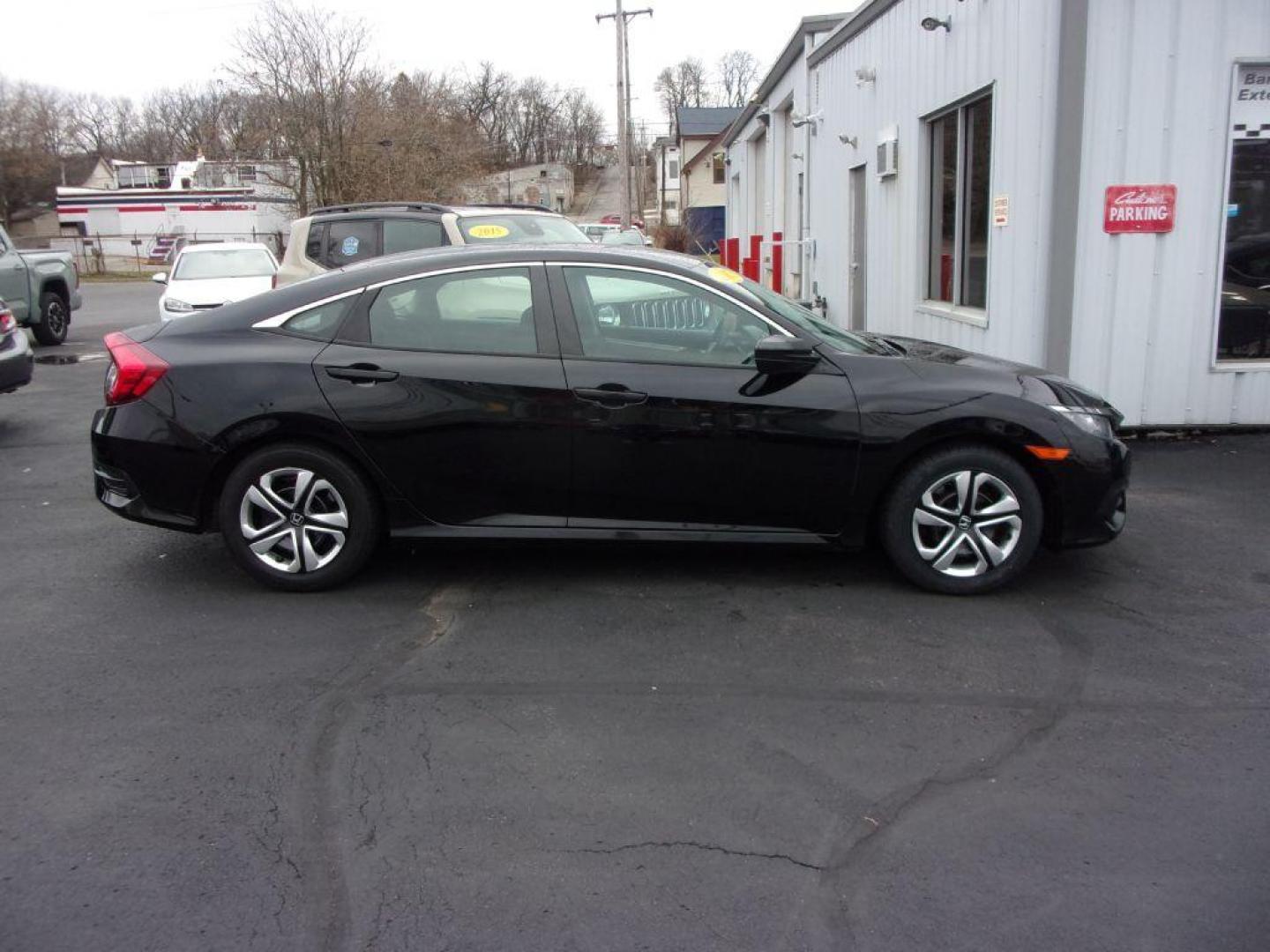 2017 BLACK HONDA CIVIC LX (19XFC2E5XHE) with an 2.0L engine, 6-Speed Manual transmission, located at 501 E. Columbia St., Springfield, OH, 45503, (800) 262-7122, 39.925262, -83.801796 - *** Serviced and Detailed *** Newer Tires *** 6-Speed Manual *** Gas Saver *** LX *** Jay North Auto has offered hand picked vehicles since 1965! Our customer's enjoy a NO pressure buying experience with a small town feel. All of our vehicles get fully inspected and detailed. We are a preferred - Photo#0