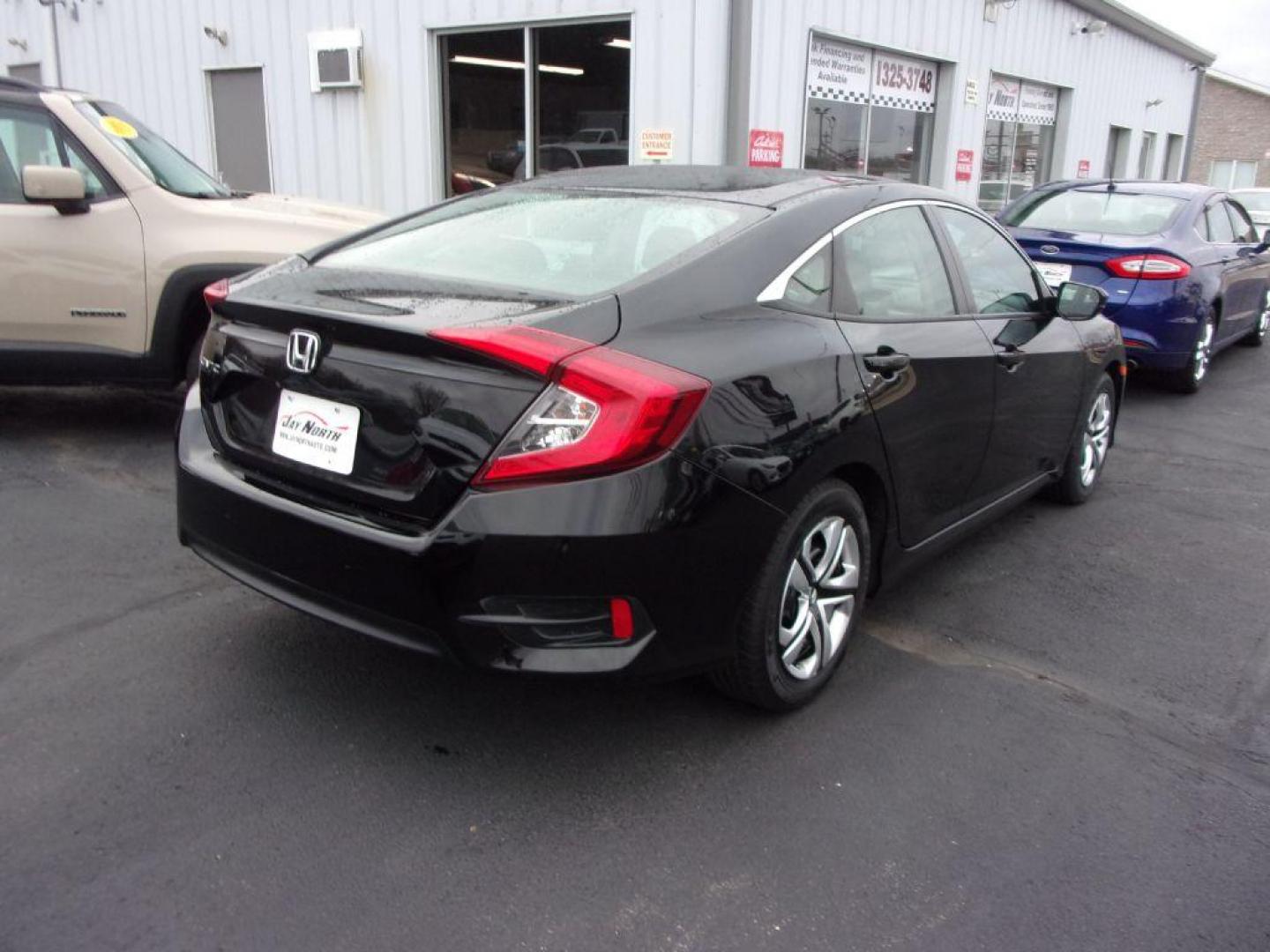 2017 BLACK HONDA CIVIC LX (19XFC2E5XHE) with an 2.0L engine, 6-Speed Manual transmission, located at 501 E. Columbia St., Springfield, OH, 45503, (800) 262-7122, 39.925262, -83.801796 - *** Serviced and Detailed *** Newer Tires *** 6-Speed Manual *** Gas Saver *** LX *** Jay North Auto has offered hand picked vehicles since 1965! Our customer's enjoy a NO pressure buying experience with a small town feel. All of our vehicles get fully inspected and detailed. We are a preferred - Photo#3