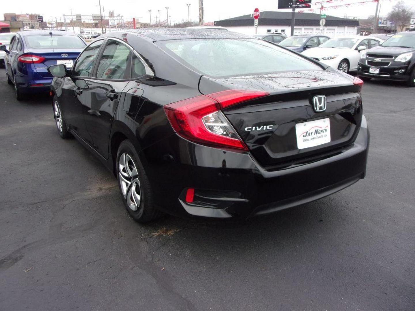 2017 BLACK HONDA CIVIC LX (19XFC2E5XHE) with an 2.0L engine, 6-Speed Manual transmission, located at 501 E. Columbia St., Springfield, OH, 45503, (800) 262-7122, 39.925262, -83.801796 - *** Serviced and Detailed *** Newer Tires *** 6-Speed Manual *** Gas Saver *** LX *** Jay North Auto has offered hand picked vehicles since 1965! Our customer's enjoy a NO pressure buying experience with a small town feel. All of our vehicles get fully inspected and detailed. We are a preferred - Photo#5