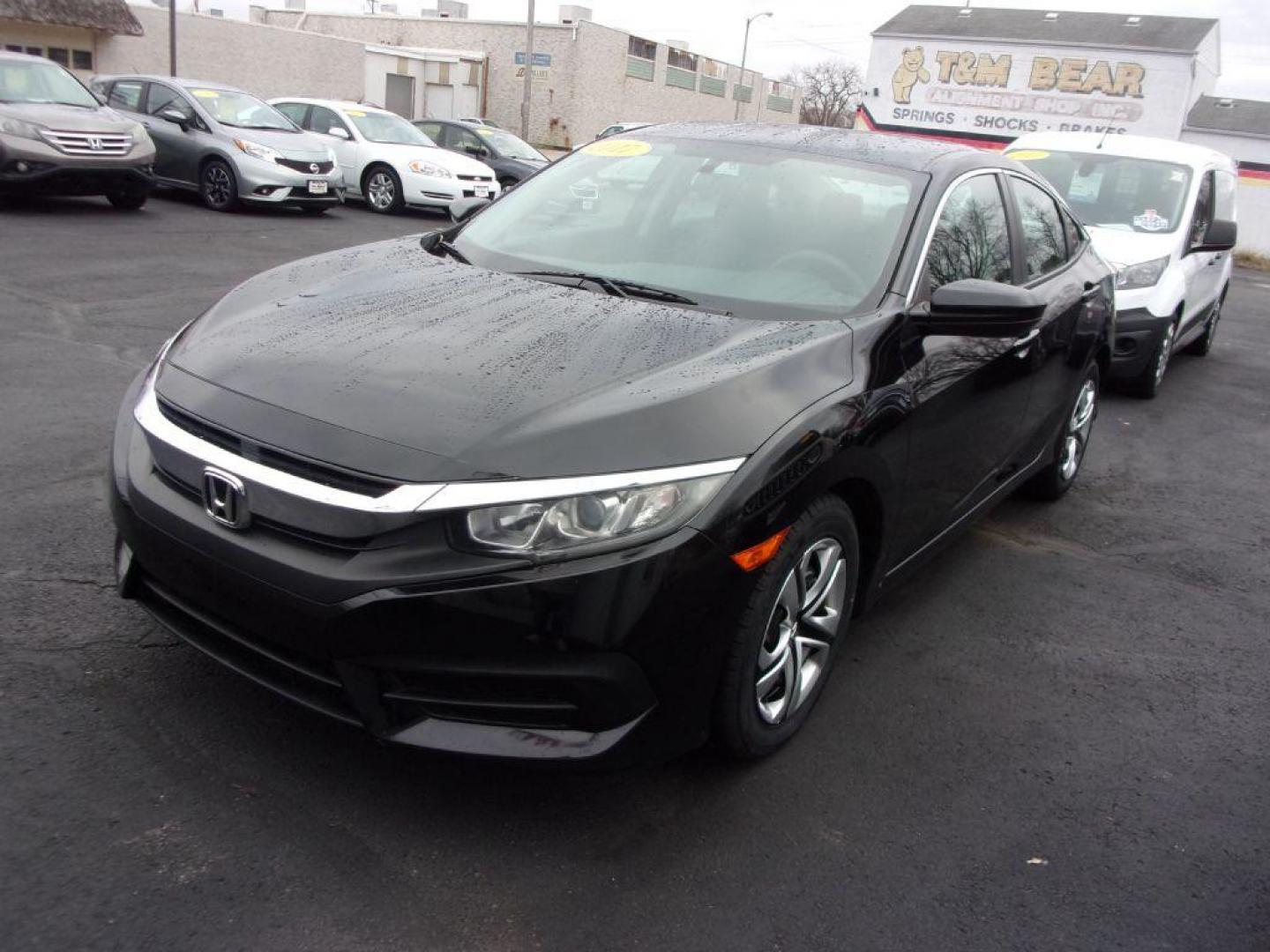 2017 BLACK HONDA CIVIC LX (19XFC2E5XHE) with an 2.0L engine, 6-Speed Manual transmission, located at 501 E. Columbia St., Springfield, OH, 45503, (800) 262-7122, 39.925262, -83.801796 - *** Serviced and Detailed *** Newer Tires *** 6-Speed Manual *** Gas Saver *** LX *** Jay North Auto has offered hand picked vehicles since 1965! Our customer's enjoy a NO pressure buying experience with a small town feel. All of our vehicles get fully inspected and detailed. We are a preferred - Photo#6