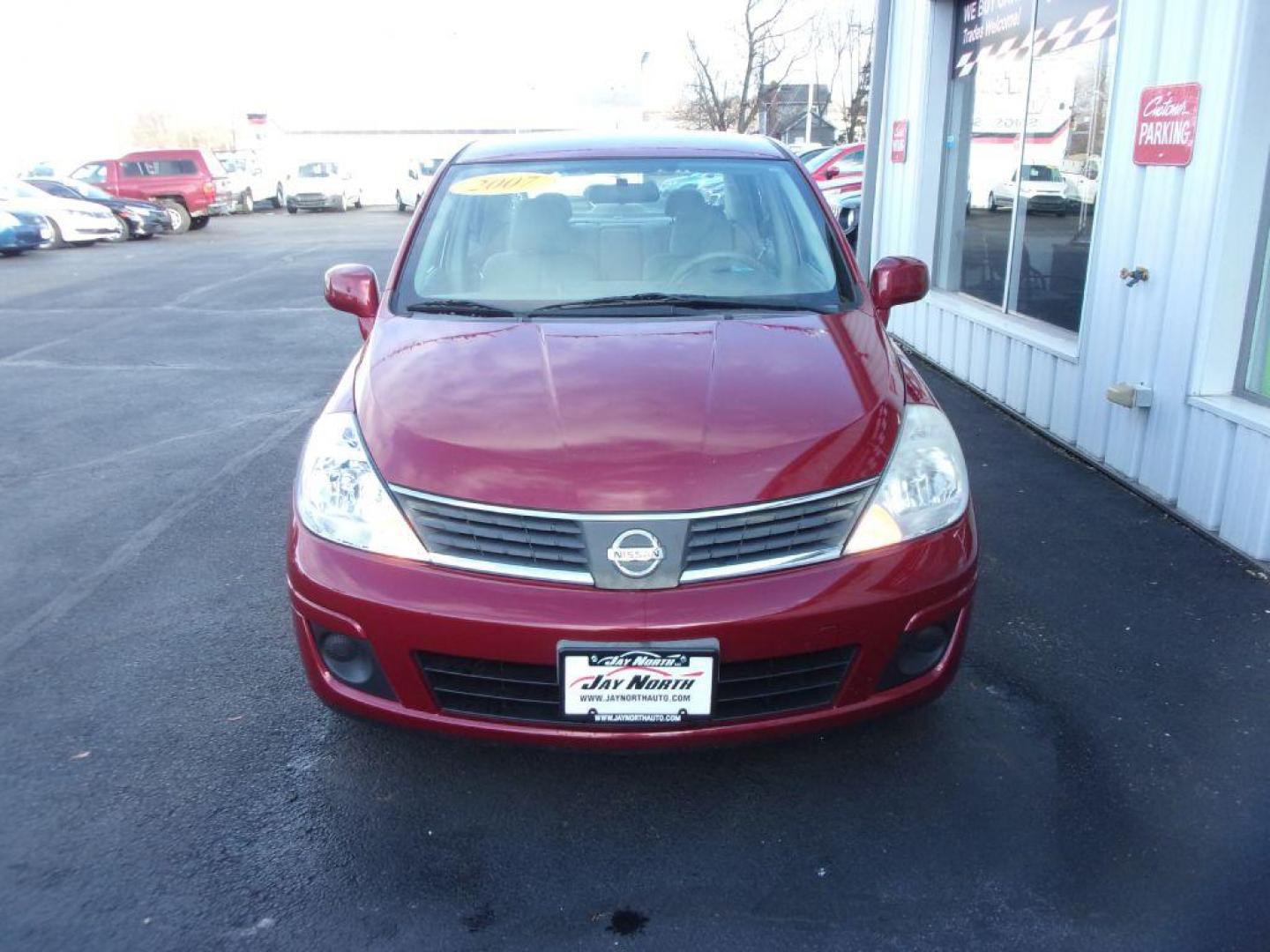 2007 RED NISSAN VERSA S (3N1BC11E77L) with an 1.8L engine, Automatic transmission, located at 501 E. Columbia St., Springfield, OH, 45503, (800) 262-7122, 39.925262, -83.801796 - Photo#1