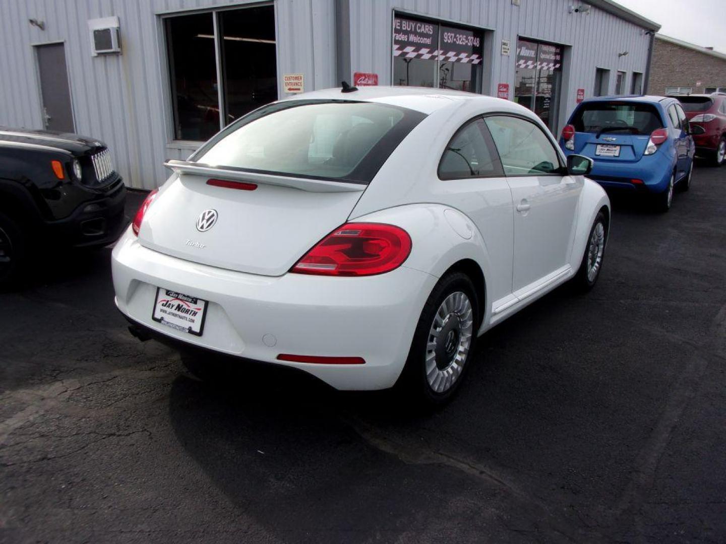 2016 WHITE VOLKSWAGEN BEETLE SE (3VWJ17AT2GM) with an 1.8L engine, Automatic transmission, located at 501 E. Columbia St., Springfield, OH, 45503, (800) 262-7122, 39.925262, -83.801796 - *** New Tires *** Clean CarFax w/ 2 Owners *** Serviced and Detailed *** SE *** Back Up Camera *** NICE!!! *** Jay North Auto has offered hand picked vehicles since 1965! Our customer's enjoy a NO pressure buying experience with a small town feel. All of our vehicles get fully inspected and deta - Photo#3