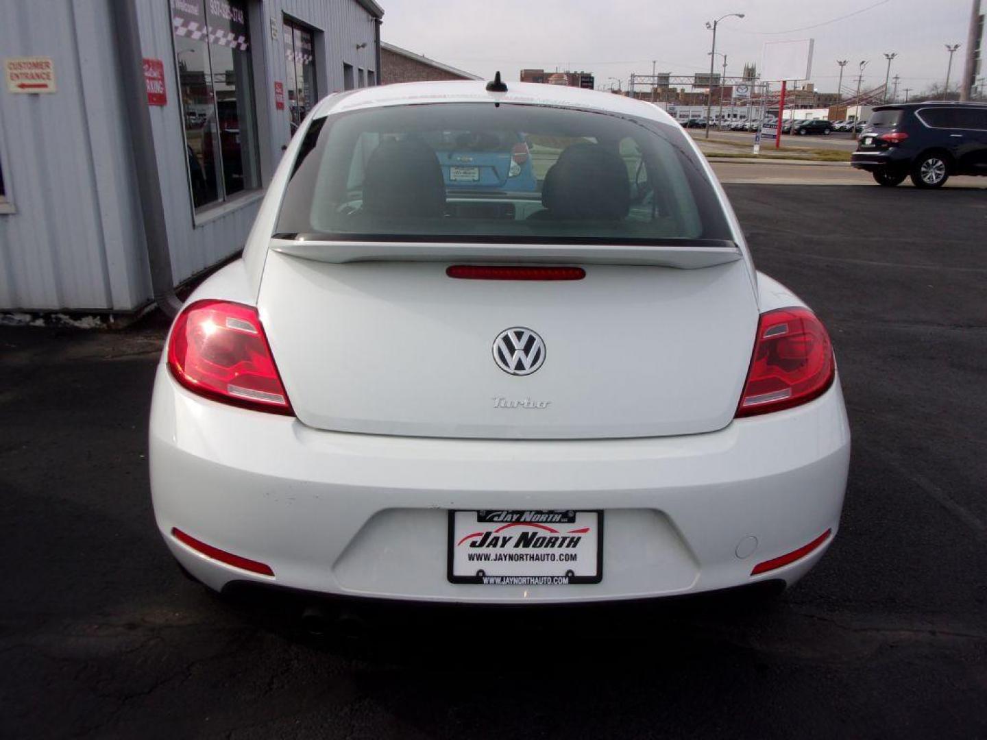 2016 WHITE VOLKSWAGEN BEETLE SE (3VWJ17AT2GM) with an 1.8L engine, Automatic transmission, located at 501 E. Columbia St., Springfield, OH, 45503, (800) 262-7122, 39.925262, -83.801796 - *** New Tires *** Clean CarFax w/ 2 Owners *** Serviced and Detailed *** SE *** Back Up Camera *** NICE!!! *** Jay North Auto has offered hand picked vehicles since 1965! Our customer's enjoy a NO pressure buying experience with a small town feel. All of our vehicles get fully inspected and deta - Photo#4