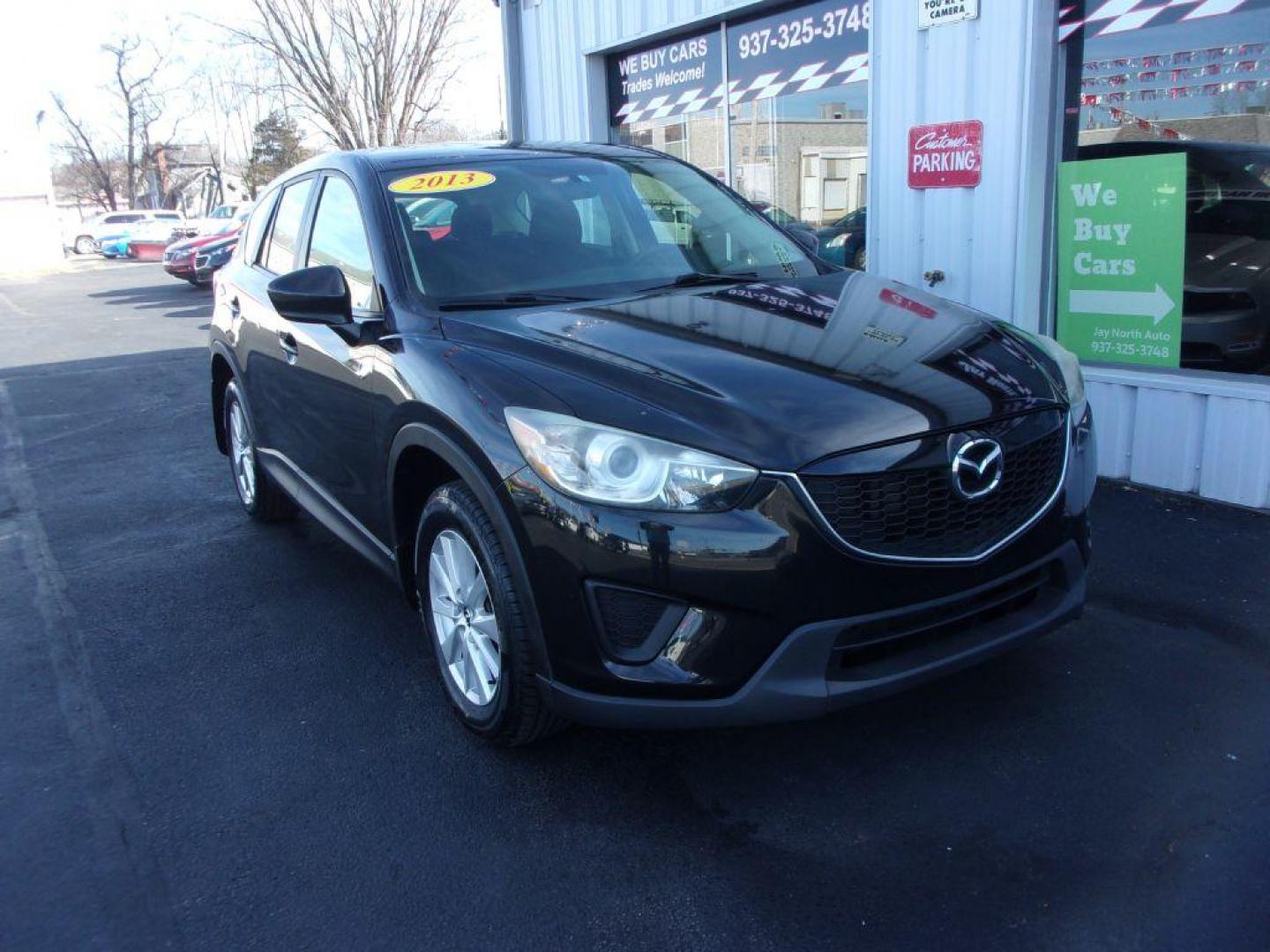 2013 BLACK MAZDA CX-5 SPORT (JM3KE2BE9D0) with an 2.0L engine, 6-Speed Manual transmission, located at 501 E. Columbia St., Springfield, OH, 45503, (800) 262-7122, 39.925262, -83.801796 - Photo#0