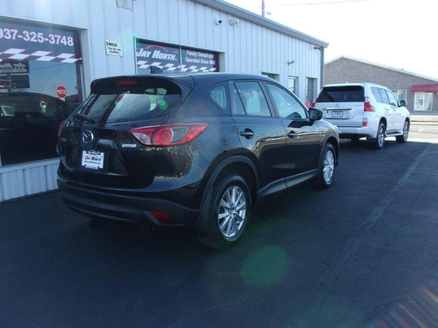 2013 BLACK MAZDA CX-5 SPORT (JM3KE2BE9D0) with an 2.0L engine, 6-Speed Manual transmission, located at 501 E. Columbia St., Springfield, OH, 45503, (800) 262-7122, 39.925262, -83.801796 - Photo#3