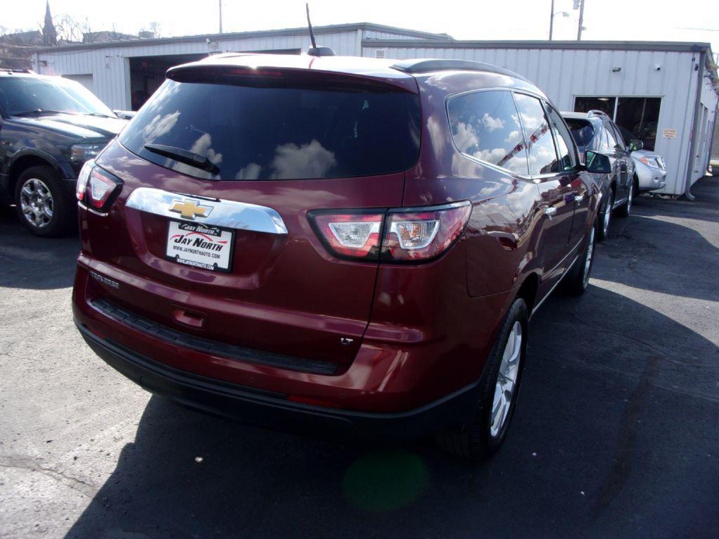 2017 RED CHEVROLET TRAVERSE LT (1GNKRGKD6HJ) with an 3.6L engine, Automatic transmission, located at 501 E. Columbia St., Springfield, OH, 45503, (800) 262-7122, 39.925262, -83.801796 - *** LT *** FWD *** 3rd Row Seating *** Remote Start *** Serviced and Detailed *** Jay North Auto has offered hand picked vehicles since 1965! Our customer's enjoy a NO pressure buying experience with a small town feel. All of our vehicles get fully inspected and detailed. We are a preferred deal - Photo#3