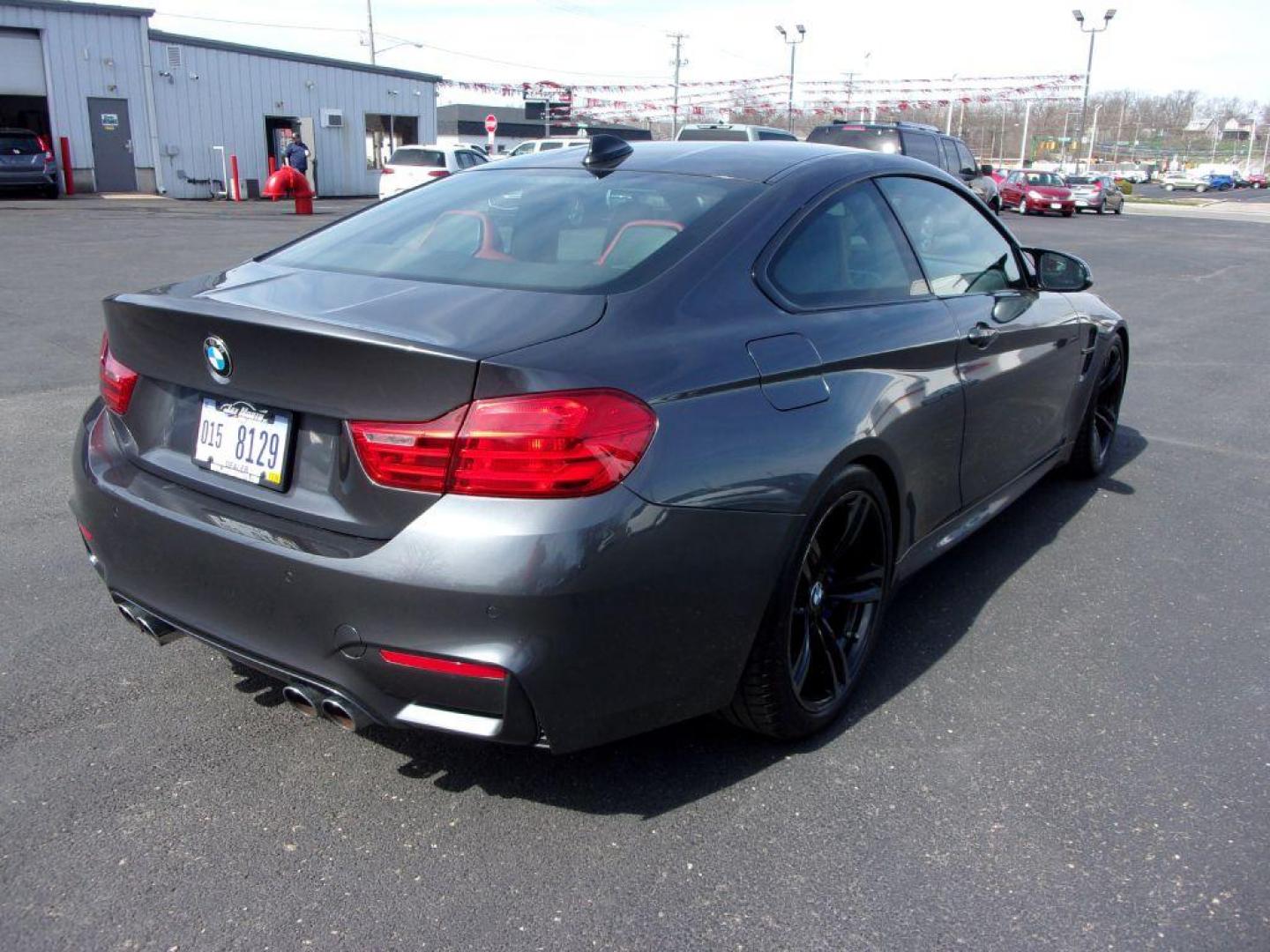 2015 GRAY BMW M4 (WBS3R9C58FK) with an 3.0L engine, 6-Speed Manual transmission, located at 501 E. Columbia St., Springfield, OH, 45503, (800) 262-7122, 39.925262, -83.801796 - ***6 SPEED MANUAL TRANSMISSION*** New oil pan gasket at Kelly BMW, new brakes and 4 new Michelin Pilot Sport 4S tires, all within the last 5K miles. Jay bought this car from a close friend who's owned it since March 2018 with 21000 miles and serviced it religiously at Kelly BMW in Columbus, Oh. O - Photo#2