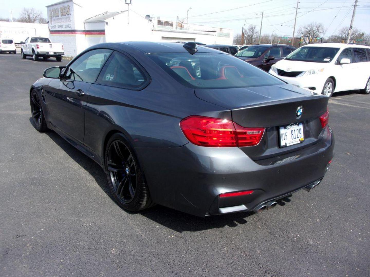 2015 GRAY BMW M4 (WBS3R9C58FK) with an 3.0L engine, 6-Speed Manual transmission, located at 501 E. Columbia St., Springfield, OH, 45503, (800) 262-7122, 39.925262, -83.801796 - ***6 SPEED MANUAL TRANSMISSION*** New oil pan gasket at Kelly BMW, new brakes and 4 new Michelin Pilot Sport 4S tires, all within the last 5K miles. Jay bought this car from a close friend who's owned it since March 2018 with 21000 miles and serviced it religiously at Kelly BMW in Columbus, Oh. O - Photo#4