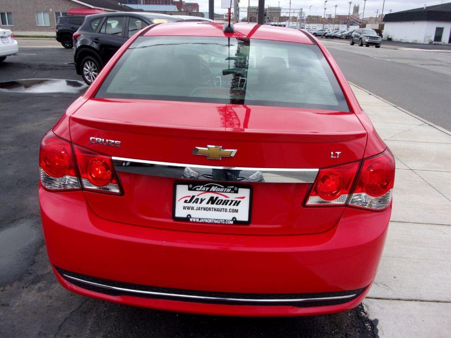 2015 RED CHEVROLET CRUZE 2LT (1G1PE5SB4F7) with an 1.4L engine, Automatic transmission, located at 501 E. Columbia St., Springfield, OH, 45503, (800) 262-7122, 39.925262, -83.801796 - *** LT *** Serviced and Detailed *** Clean CarFax *** FWD *** Gas Saver *** Jay North Auto has offered hand picked vehicles since 1965! Our customer's enjoy a NO pressure buying experience with a small town feel. All of our vehicles get fully inspected and detailed. We are a preferred dealer for - Photo#4