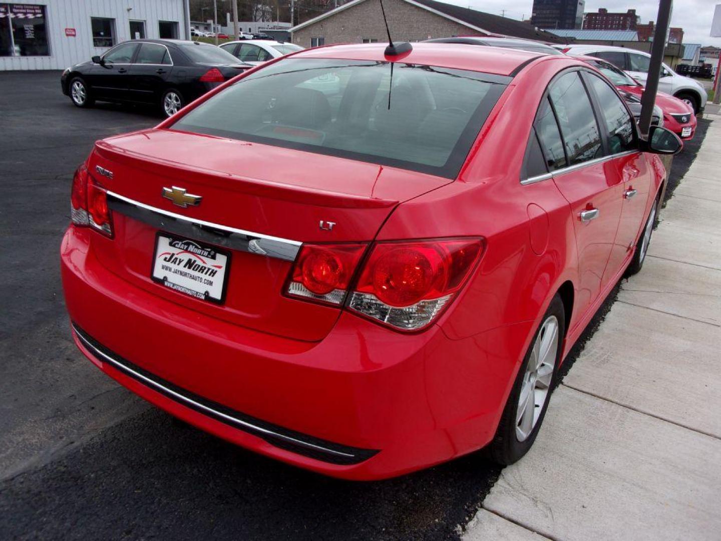 2015 RED CHEVROLET CRUZE 2LT (1G1PE5SB4F7) with an 1.4L engine, Automatic transmission, located at 501 E. Columbia St., Springfield, OH, 45503, (800) 262-7122, 39.925262, -83.801796 - *** LT *** Serviced and Detailed *** Clean CarFax *** FWD *** Gas Saver *** Jay North Auto has offered hand picked vehicles since 1965! Our customer's enjoy a NO pressure buying experience with a small town feel. All of our vehicles get fully inspected and detailed. We are a preferred dealer for - Photo#5