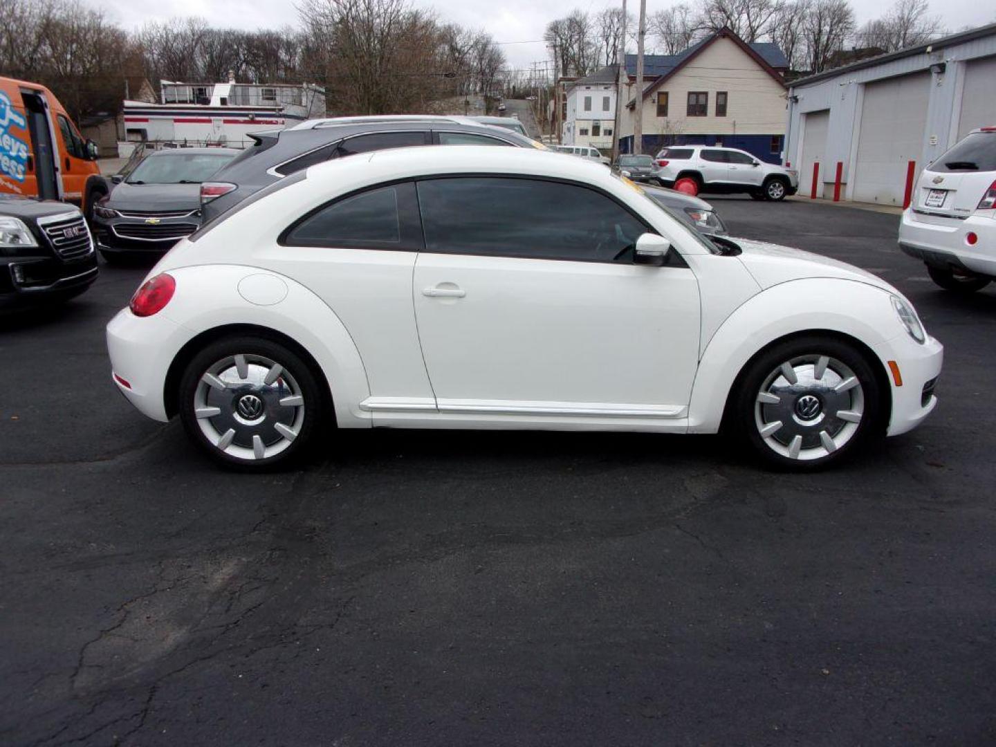 2012 WHITE VOLKSWAGEN BEETLE (3VWJP7AT8CM) with an 2.5L engine, Automatic transmission, located at 501 E. Columbia St., Springfield, OH, 45503, (800) 262-7122, 39.925262, -83.801796 - ***Clean Carfax***2.5L***Heated Leather Seating***Fender Audio***Navigation***Serviced and Detailed*** Jay North Auto has offered hand picked vehicles since 1965! Our customer's enjoy a NO pressure buying experience with a small town feel. All of our vehicles get fully inspected and detailed. We - Photo#0