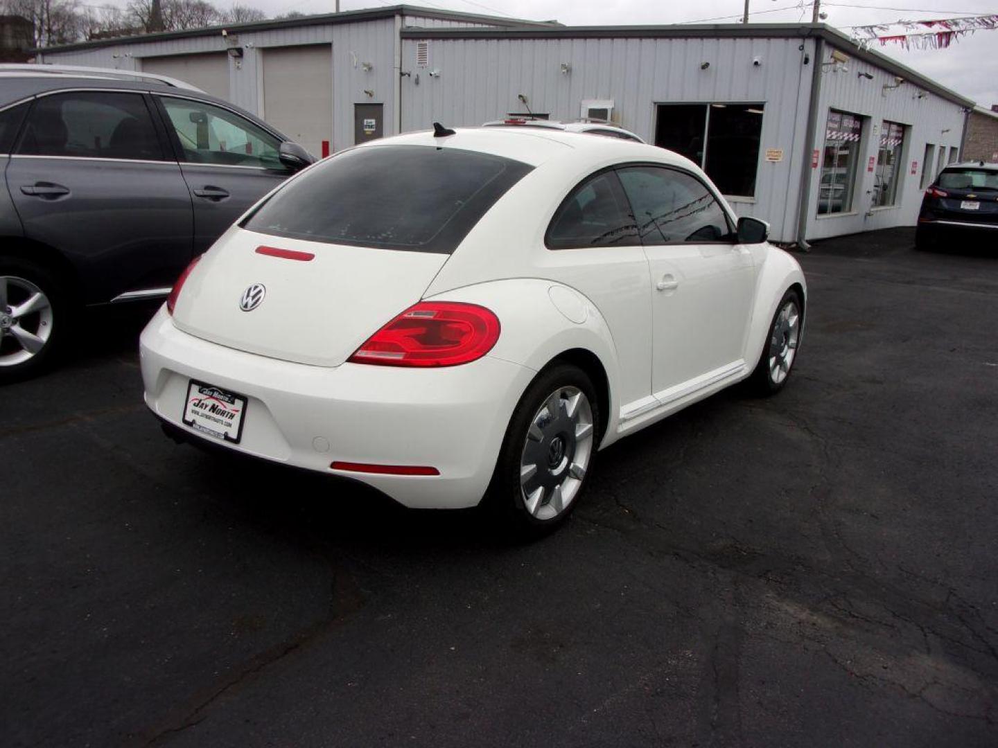 2012 WHITE VOLKSWAGEN BEETLE (3VWJP7AT8CM) with an 2.5L engine, Automatic transmission, located at 501 E. Columbia St., Springfield, OH, 45503, (800) 262-7122, 39.925262, -83.801796 - ***Clean Carfax***2.5L***Heated Leather Seating***Fender Audio***Navigation***Serviced and Detailed*** Jay North Auto has offered hand picked vehicles since 1965! Our customer's enjoy a NO pressure buying experience with a small town feel. All of our vehicles get fully inspected and detailed. We - Photo#3