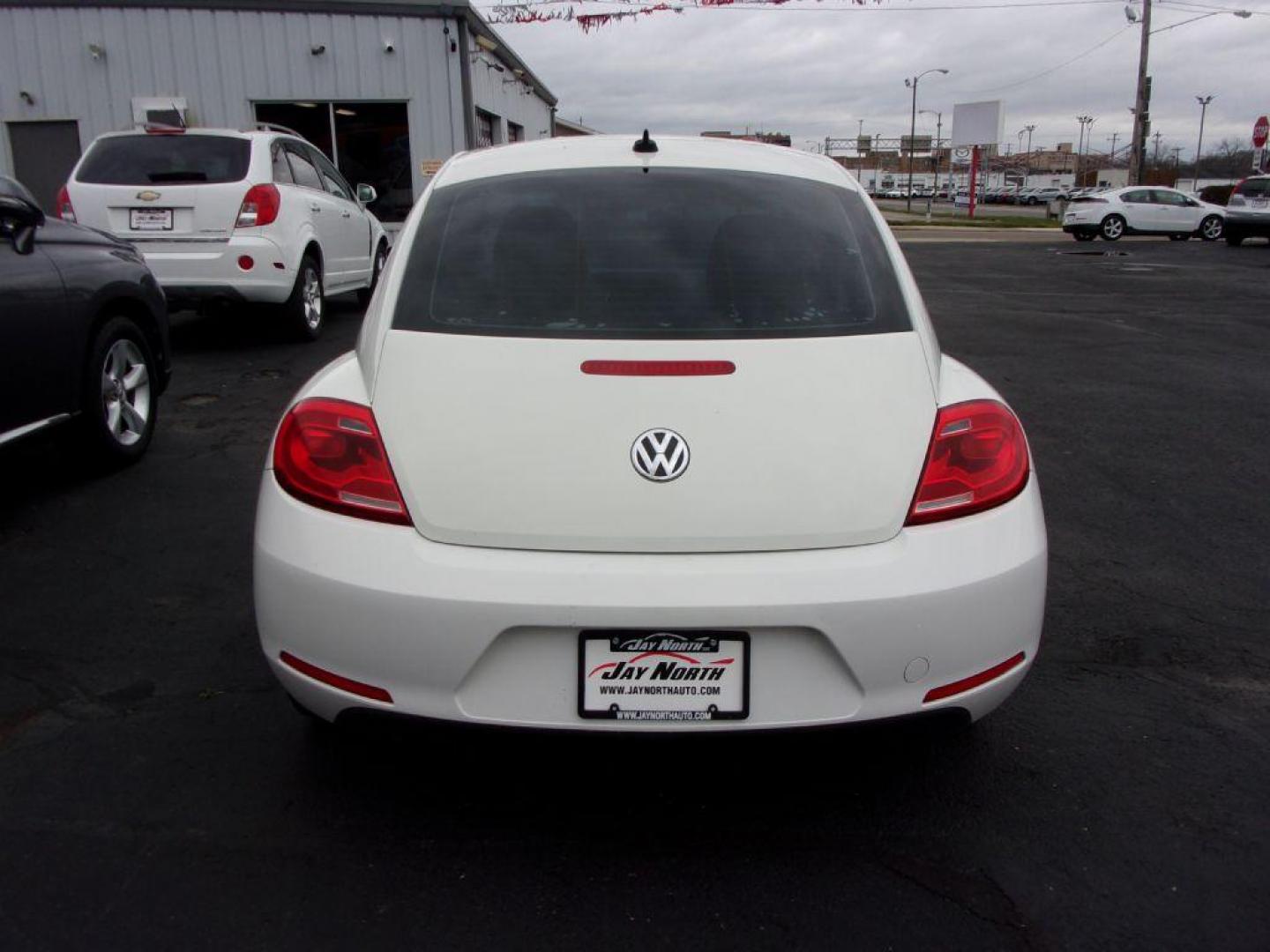 2012 WHITE VOLKSWAGEN BEETLE (3VWJP7AT8CM) with an 2.5L engine, Automatic transmission, located at 501 E. Columbia St., Springfield, OH, 45503, (800) 262-7122, 39.925262, -83.801796 - ***Clean Carfax***2.5L***Heated Leather Seating***Fender Audio***Navigation***Serviced and Detailed*** Jay North Auto has offered hand picked vehicles since 1965! Our customer's enjoy a NO pressure buying experience with a small town feel. All of our vehicles get fully inspected and detailed. We - Photo#4