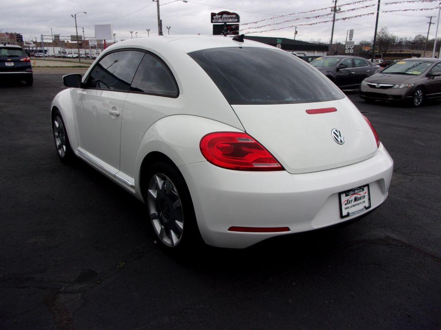 2012 WHITE VOLKSWAGEN BEETLE (3VWJP7AT8CM) with an 2.5L engine, Automatic transmission, located at 501 E. Columbia St., Springfield, OH, 45503, (800) 262-7122, 39.925262, -83.801796 - ***Clean Carfax***2.5L***Heated Leather Seating***Fender Audio***Navigation***Serviced and Detailed*** Jay North Auto has offered hand picked vehicles since 1965! Our customer's enjoy a NO pressure buying experience with a small town feel. All of our vehicles get fully inspected and detailed. We - Photo#5