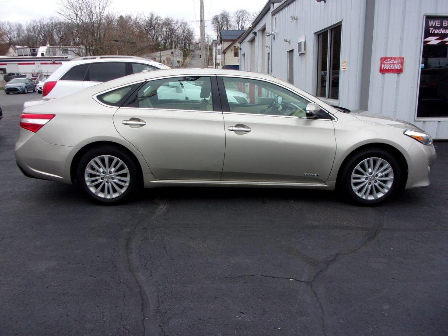 2014 TAN TOYOTA AVALON HYBRID XLE TOURING (4T1BD1EB1EU) with an 2.5L engine, Automatic transmission, located at 501 E. Columbia St., Springfield, OH, 45503, (800) 262-7122, 39.925262, -83.801796 - Photo#0