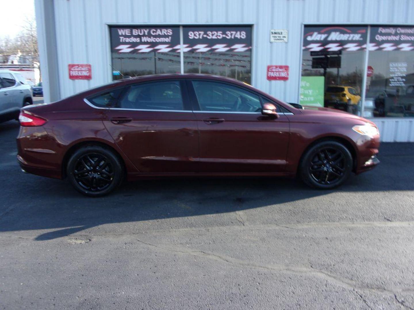 2015 BROWN FORD FUSION SE (3FA6P0H78FR) with an 2.5L engine, Automatic transmission, located at 501 E. Columbia St., Springfield, OH, 45503, (800) 262-7122, 39.925262, -83.801796 - ***New Tires***New Front and Rear Pads and Rotors***SE***Serviced and Detailed*** Jay North Auto has offered hand picked vehicles since 1965! Our customer's enjoy a NO pressure buying experience with a small town feel. All of our vehicles get fully inspected and detailed. We are a preferred deal - Photo#0