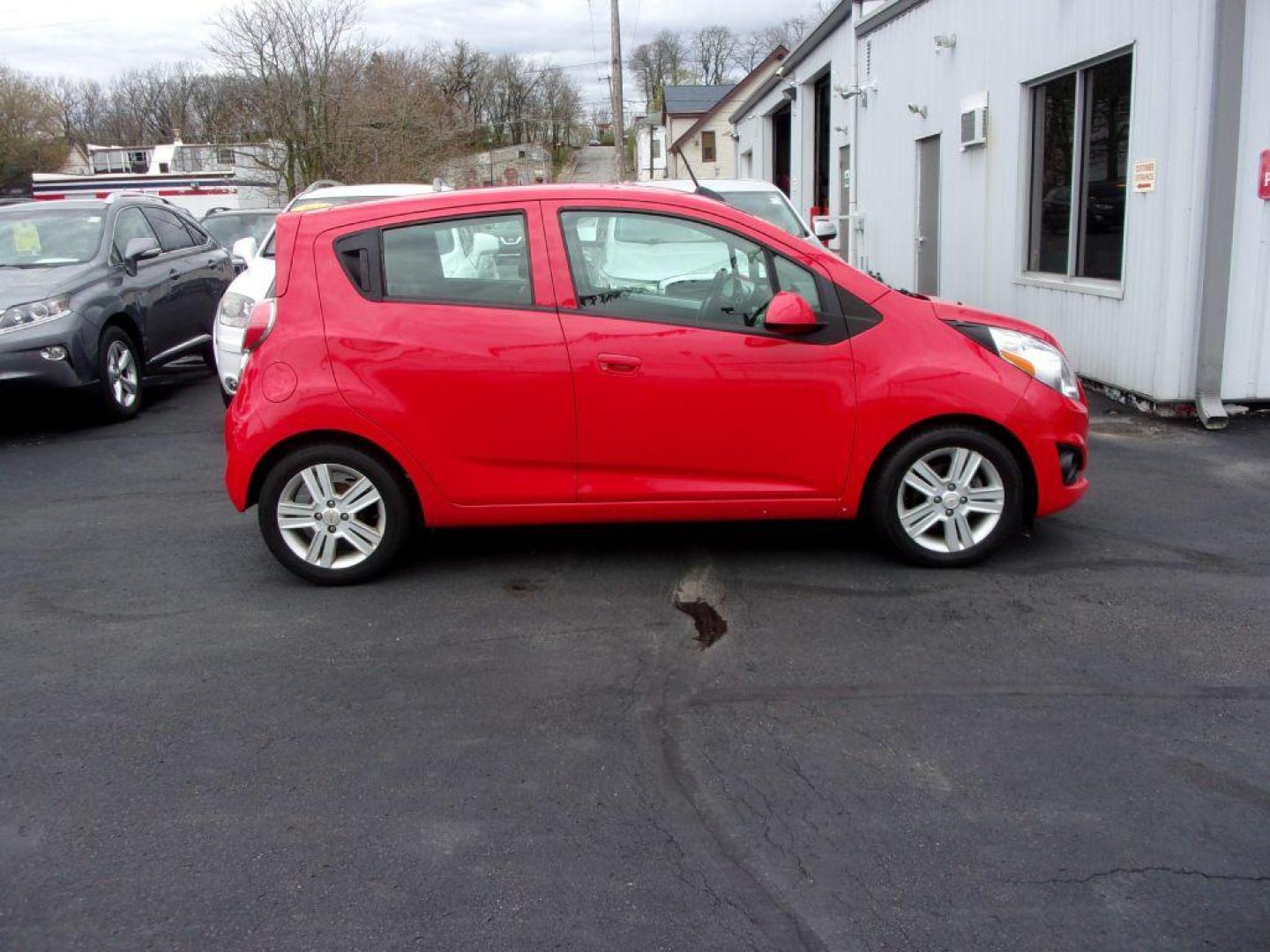 2015 RED CHEVROLET SPARK LS (KL8CB6S95FC) with an 1.2L engine, Continuously Variable transmission, located at 501 E. Columbia St., Springfield, OH, 45503, (800) 262-7122, 39.925262, -83.801796 - Photo#0