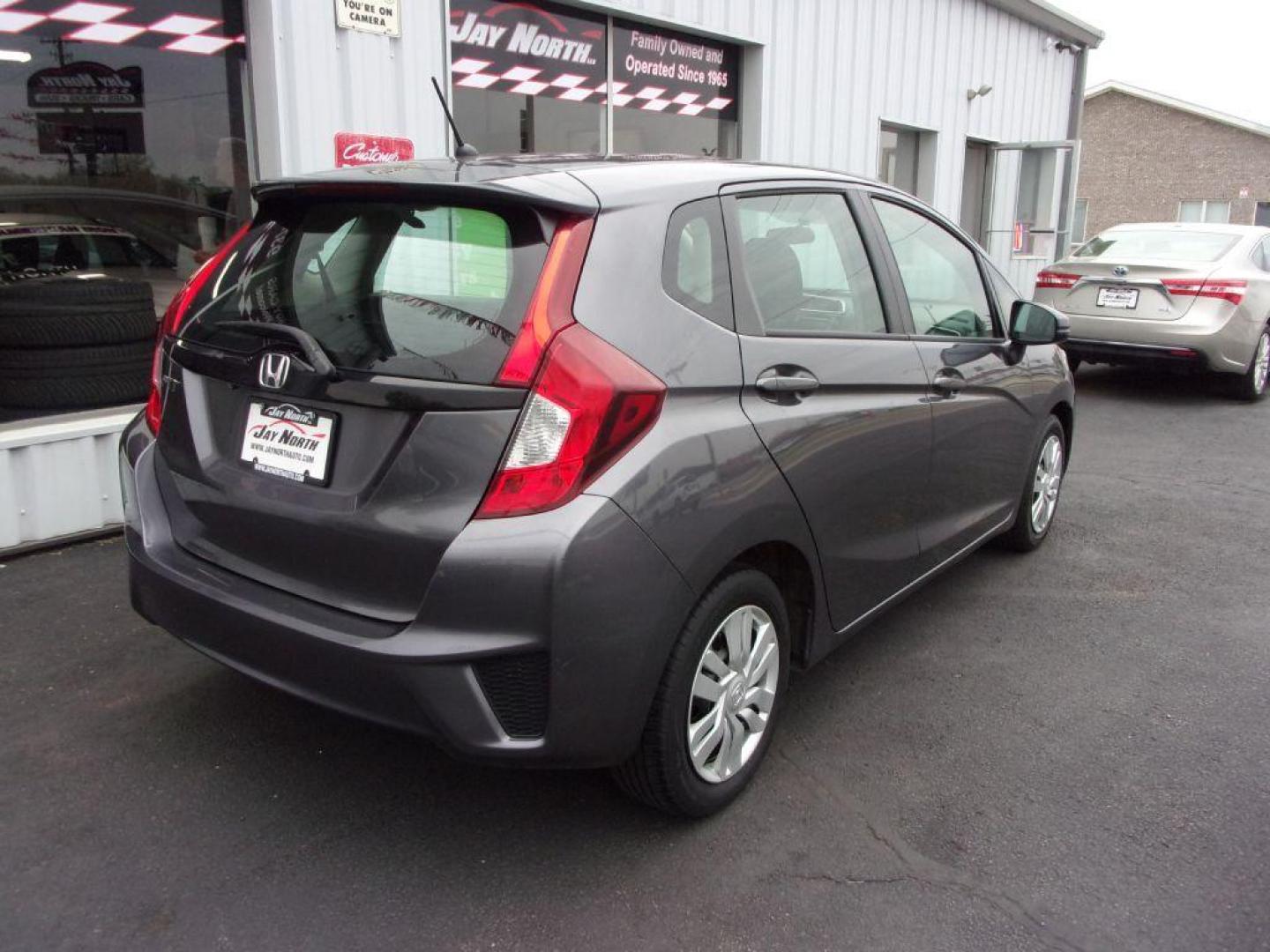 2015 GRAY HONDA FIT LX (3HGGK5G58FM) with an 1.5L engine, Manual transmission, located at 501 E. Columbia St., Springfield, OH, 45503, (800) 262-7122, 39.925262, -83.801796 - ***Clean Carfax***Updated Timing***LX***6-Speed***Serviced and Detailed*** Jay North Auto has offered hand picked vehicles since 1965! Our customer's enjoy a NO pressure buying experience with a small town feel. All of our vehicles get fully inspected and detailed. We are a preferred dealer for - Photo#3