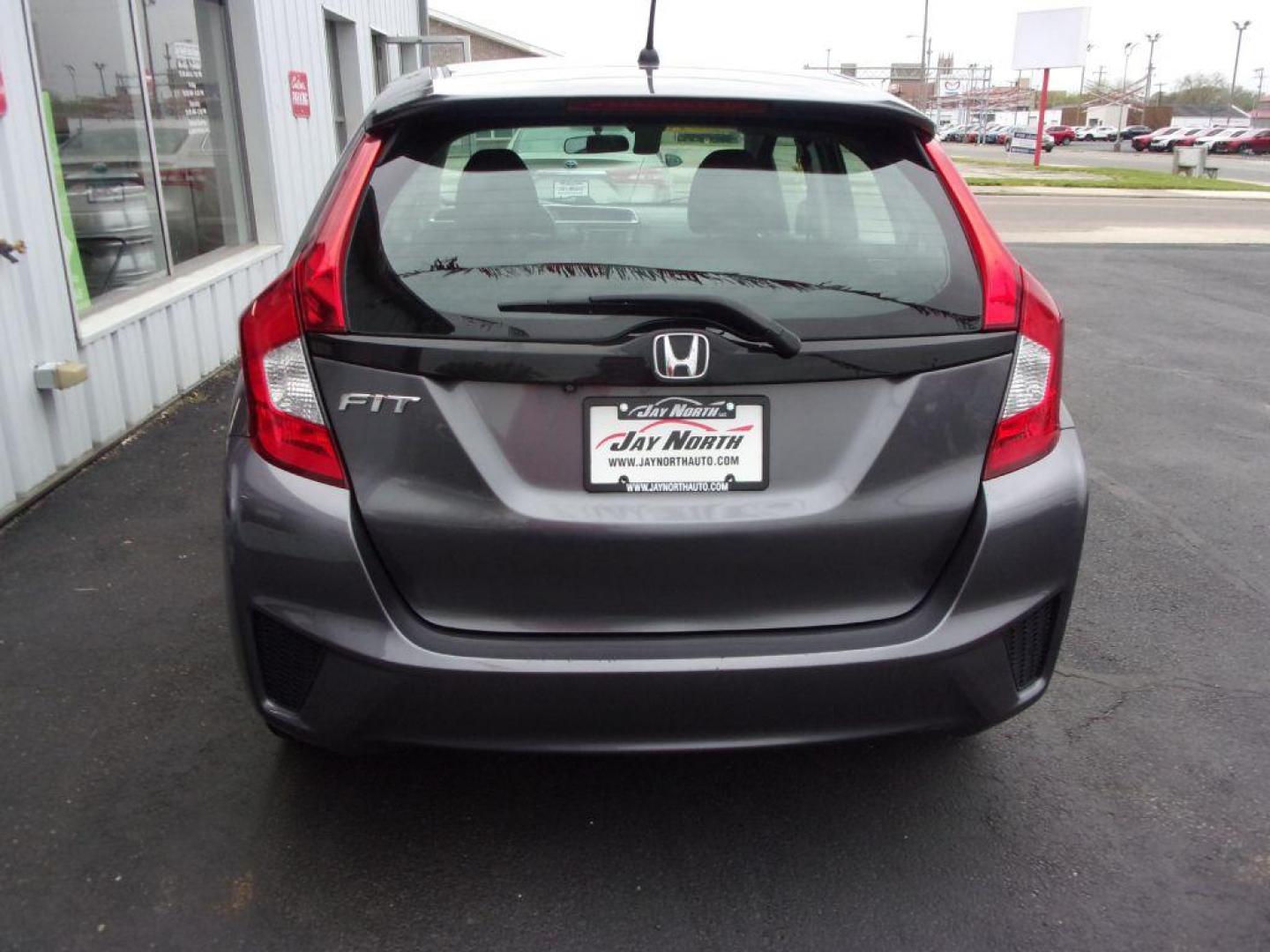 2015 GRAY HONDA FIT LX (3HGGK5G58FM) with an 1.5L engine, Manual transmission, located at 501 E. Columbia St., Springfield, OH, 45503, (800) 262-7122, 39.925262, -83.801796 - ***Clean Carfax***Updated Timing***LX***6-Speed***Serviced and Detailed*** Jay North Auto has offered hand picked vehicles since 1965! Our customer's enjoy a NO pressure buying experience with a small town feel. All of our vehicles get fully inspected and detailed. We are a preferred dealer for - Photo#4