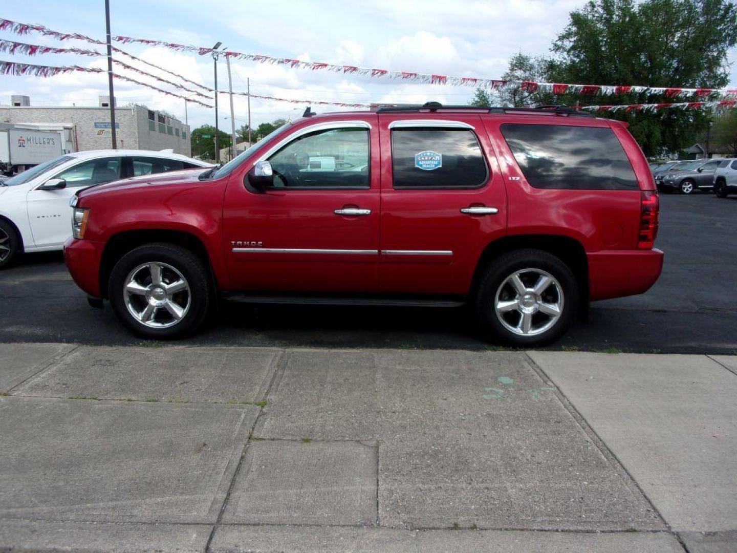 2013 RED CHEVROLET TAHOE 1500 LTZ (1GNSKCE08DR) with an 5.3L engine, Automatic transmission, located at 501 E. Columbia St., Springfield, OH, 45503, (800) 262-7122, 39.925262, -83.801796 - *** LTZ *** Serviced and Detailed *** Heated and Cooled Leather Seating *** Third Row Seating *** Moonroof *** Pioneer Audio **8 Premium Wheels *** LOADED *** Rides and Drives Great *** 5.3L V8 4x4 *** Jay North Auto has offered hand picked vehicles since 1965! Our customer's enjoy a NO pressure - Photo#0