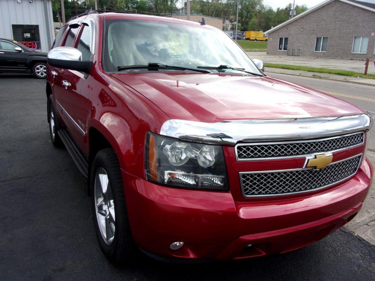 2013 RED CHEVROLET TAHOE 1500 LTZ (1GNSKCE08DR) with an 5.3L engine, Automatic transmission, located at 501 E. Columbia St., Springfield, OH, 45503, (800) 262-7122, 39.925262, -83.801796 - *** LTZ *** Serviced and Detailed *** Heated and Cooled Leather Seating *** Third Row Seating *** Moonroof *** Pioneer Audio **8 Premium Wheels *** LOADED *** Rides and Drives Great *** 5.3L V8 4x4 *** Jay North Auto has offered hand picked vehicles since 1965! Our customer's enjoy a NO pressure - Photo#3