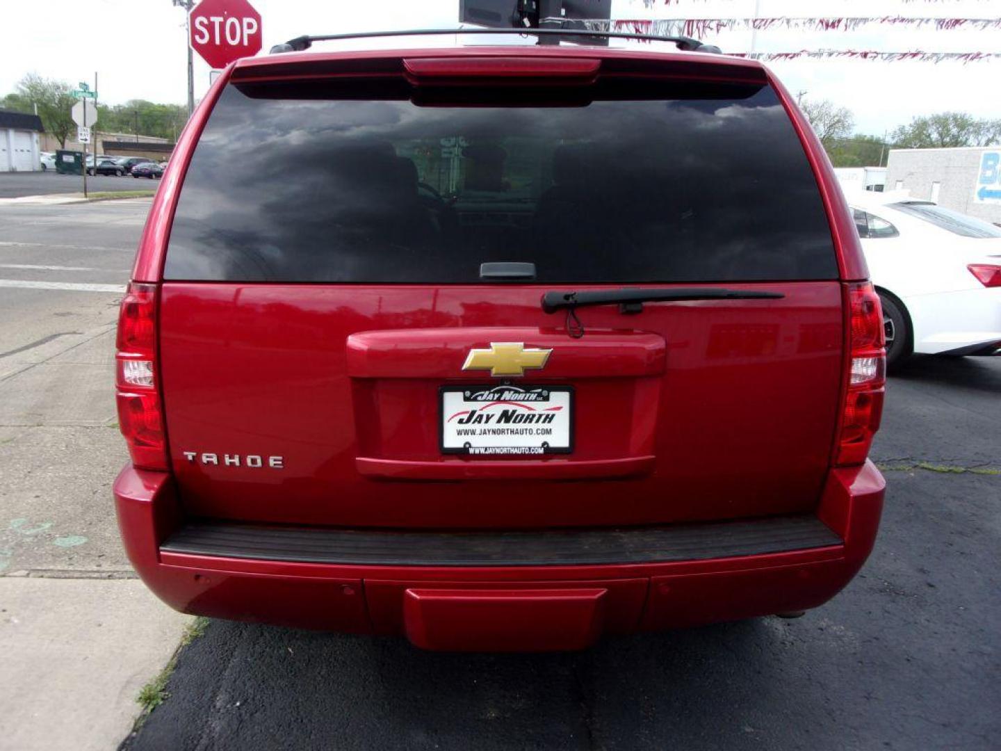 2013 RED CHEVROLET TAHOE 1500 LTZ (1GNSKCE08DR) with an 5.3L engine, Automatic transmission, located at 501 E. Columbia St., Springfield, OH, 45503, (800) 262-7122, 39.925262, -83.801796 - *** LTZ *** Serviced and Detailed *** Heated and Cooled Leather Seating *** Third Row Seating *** Moonroof *** Pioneer Audio **8 Premium Wheels *** LOADED *** Rides and Drives Great *** 5.3L V8 4x4 *** Jay North Auto has offered hand picked vehicles since 1965! Our customer's enjoy a NO pressure - Photo#5