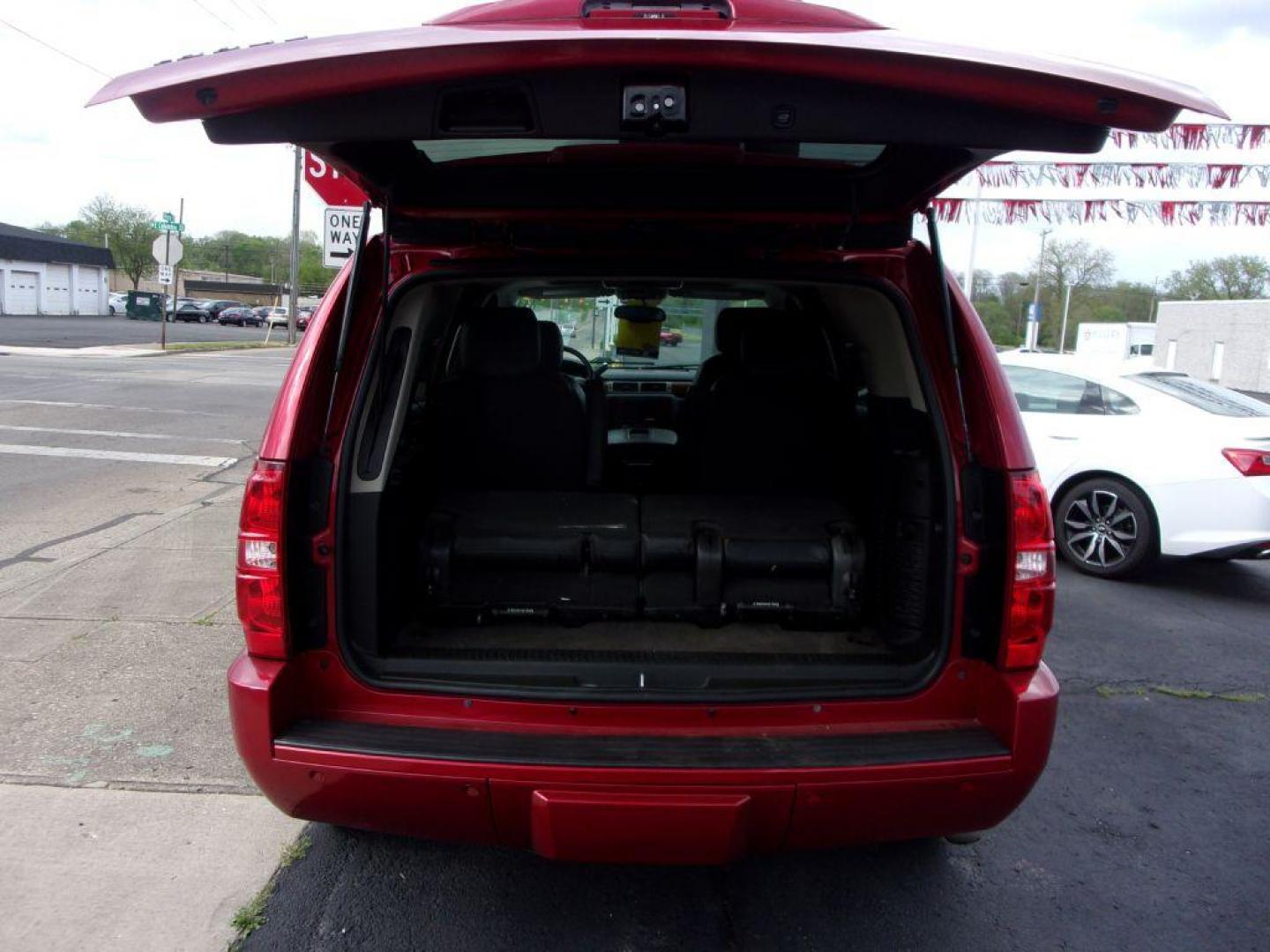 2013 RED CHEVROLET TAHOE 1500 LTZ (1GNSKCE08DR) with an 5.3L engine, Automatic transmission, located at 501 E. Columbia St., Springfield, OH, 45503, (800) 262-7122, 39.925262, -83.801796 - *** LTZ *** Serviced and Detailed *** Heated and Cooled Leather Seating *** Third Row Seating *** Moonroof *** Pioneer Audio **8 Premium Wheels *** LOADED *** Rides and Drives Great *** 5.3L V8 4x4 *** Jay North Auto has offered hand picked vehicles since 1965! Our customer's enjoy a NO pressure - Photo#7