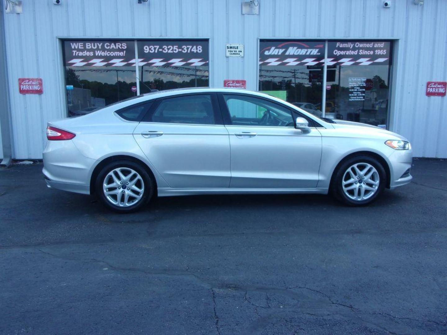 2014 SILVER FORD FUSION SE (3FA6P0H79ER) with an 2.5L engine, Automatic transmission, located at 501 E. Columbia St., Springfield, OH, 45503, (800) 262-7122, 39.925262, -83.801796 - *** New Tires *** Serviced and Detailed *** SE *** FWD *** Low Miles *** Clean CarFax *** Jay North Auto has offered hand picked vehicles since 1965! Our customer's enjoy a NO pressure buying experience with a small town feel. All of our vehicles get fully inspected and detailed. We are a prefe - Photo#0