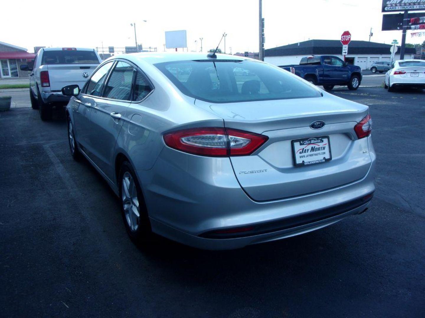 2014 SILVER FORD FUSION SE (3FA6P0H79ER) with an 2.5L engine, Automatic transmission, located at 501 E. Columbia St., Springfield, OH, 45503, (800) 262-7122, 39.925262, -83.801796 - *** New Tires *** Serviced and Detailed *** SE *** FWD *** Low Miles *** Clean CarFax *** Jay North Auto has offered hand picked vehicles since 1965! Our customer's enjoy a NO pressure buying experience with a small town feel. All of our vehicles get fully inspected and detailed. We are a prefe - Photo#5