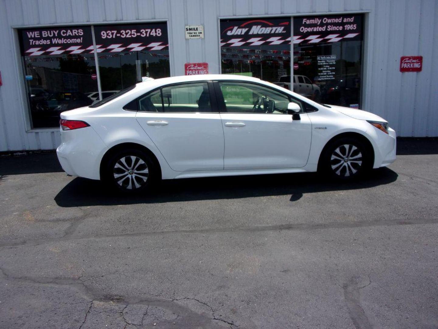 2020 WHITE TOYOTA COROLLA LE HYBRID (JTDEBRBE3LJ) with an 1.8L engine, Continuously Variable transmission, located at 501 E. Columbia St., Springfield, OH, 45503, (800) 262-7122, 39.925262, -83.801796 - Photo#0