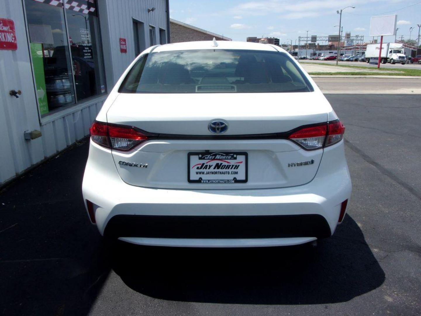 2020 WHITE TOYOTA COROLLA LE HYBRID (JTDEBRBE3LJ) with an 1.8L engine, Continuously Variable transmission, located at 501 E. Columbia St., Springfield, OH, 45503, (800) 262-7122, 39.925262, -83.801796 - Photo#4