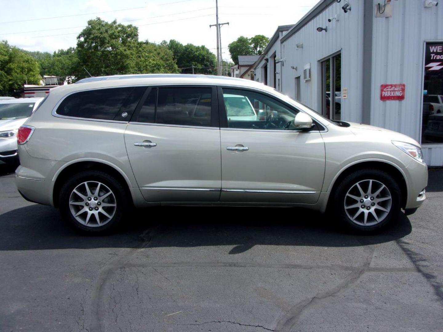 2013 GOLD BUICK ENCLAVE LEATHER GROUP (5GAKRCKD4DJ) with an 3.6L engine, Automatic transmission, located at 501 E. Columbia St., Springfield, OH, 45503, (800) 262-7122, 39.925262, -83.801796 - ***Leather Group***Dual Moonroof***3rd Row Seating***Heated Leather Seating***Rear Captian Chairs***Power Lift Gate***Serviced and Detailed*** - Photo#0