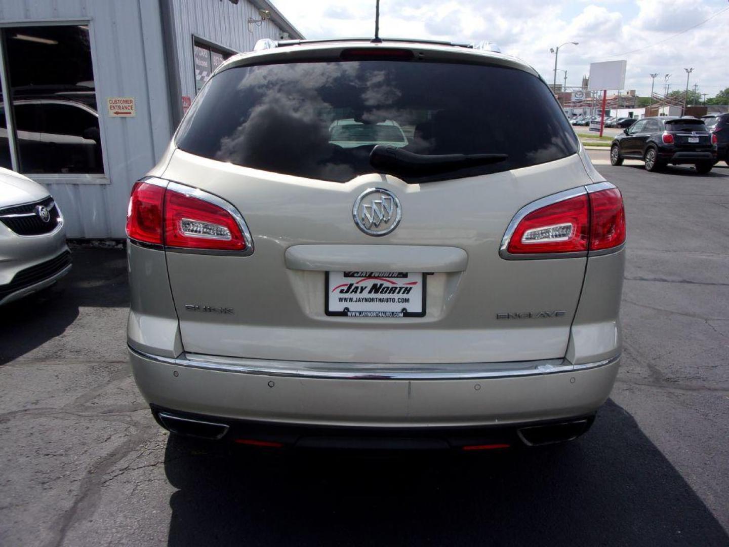 2013 GOLD BUICK ENCLAVE LEATHER GROUP (5GAKRCKD4DJ) with an 3.6L engine, Automatic transmission, located at 501 E. Columbia St., Springfield, OH, 45503, (800) 262-7122, 39.925262, -83.801796 - ***Leather Group***Dual Moonroof***3rd Row Seating***Heated Leather Seating***Rear Captian Chairs***Power Lift Gate***Serviced and Detailed*** - Photo#4